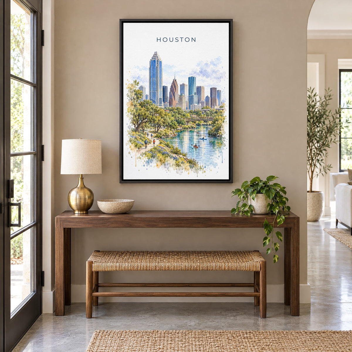 Houston watercolor print as a black floater canvas above a walnut console and woven bench in an entryway