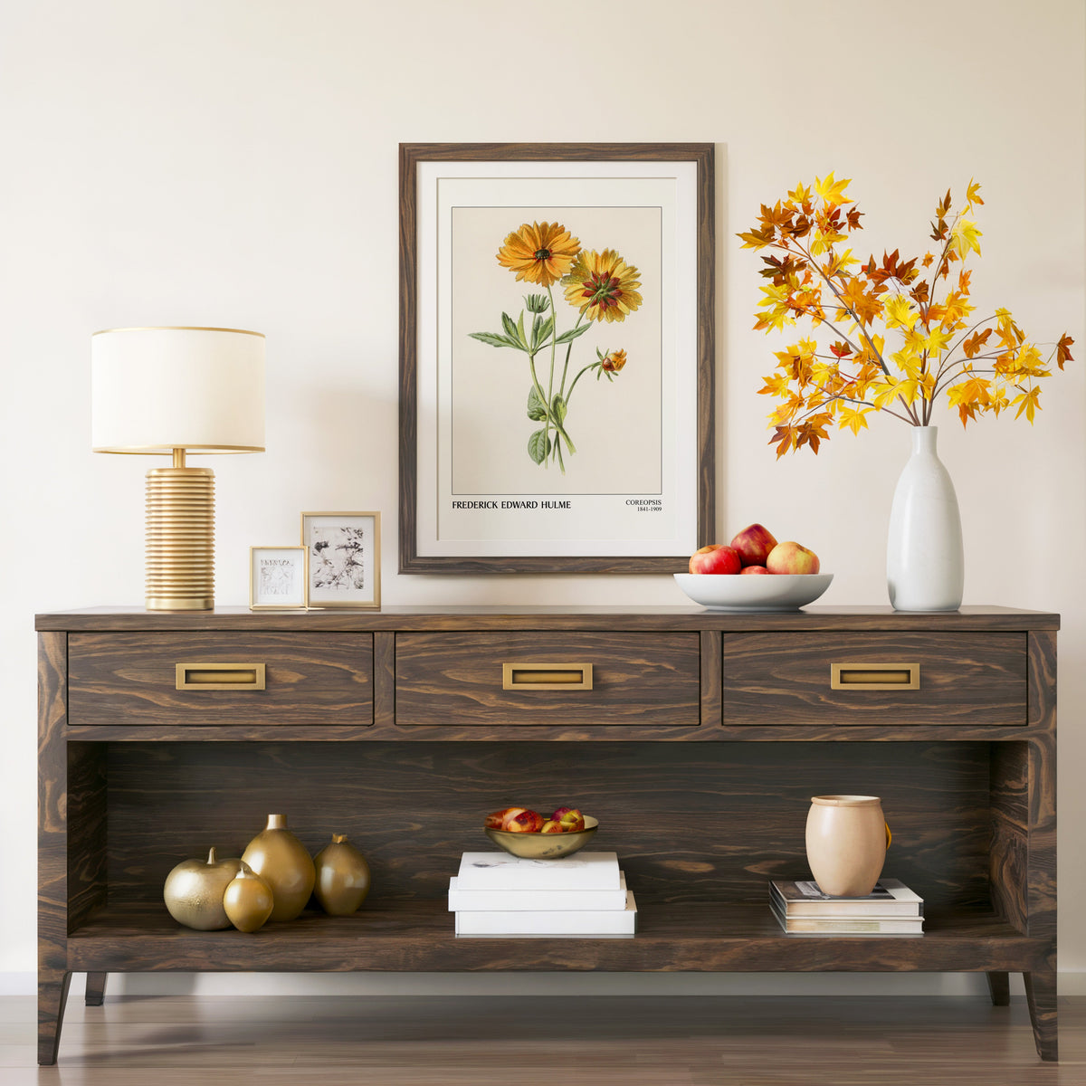 Botanical coreopsis print in a walnut frame above a console with branches