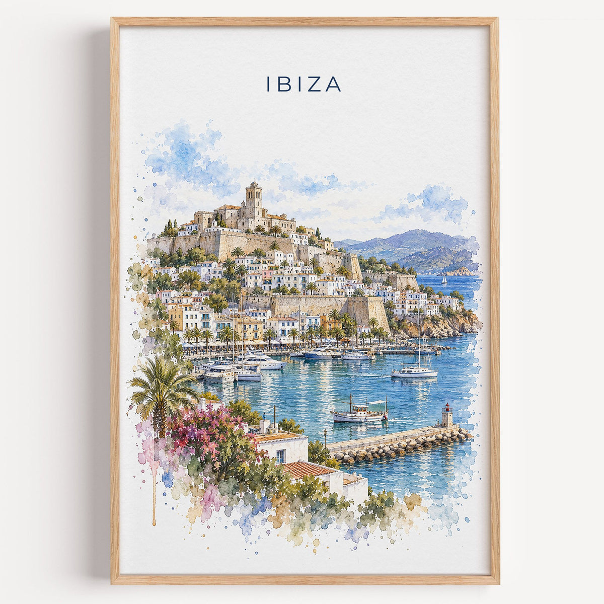 Ibiza watercolor print in a light oak frame on a plain white wall