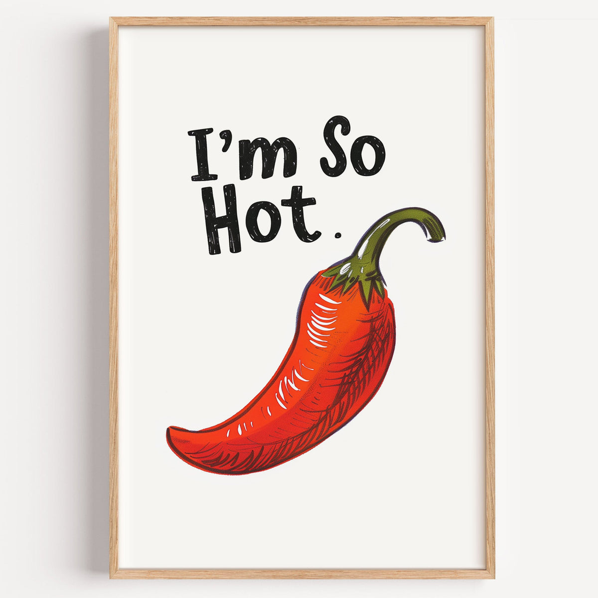 I'm So Hot red chilli print in a light oak frame on a plain white wall