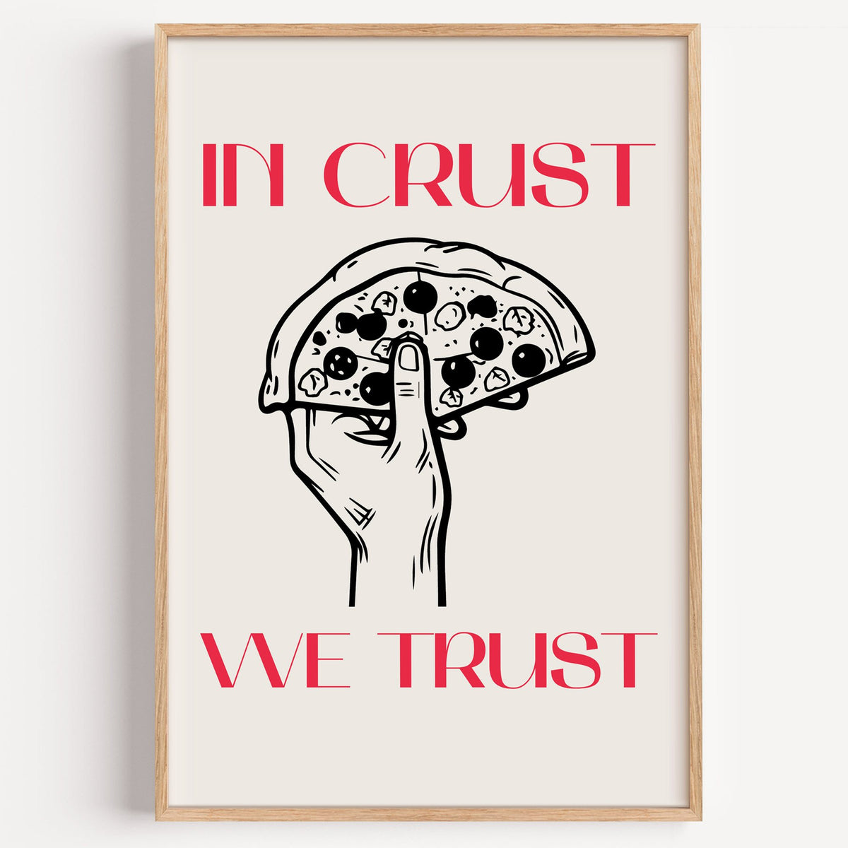 In Crust We Trust pizza print in a light oak frame on a plain white wall