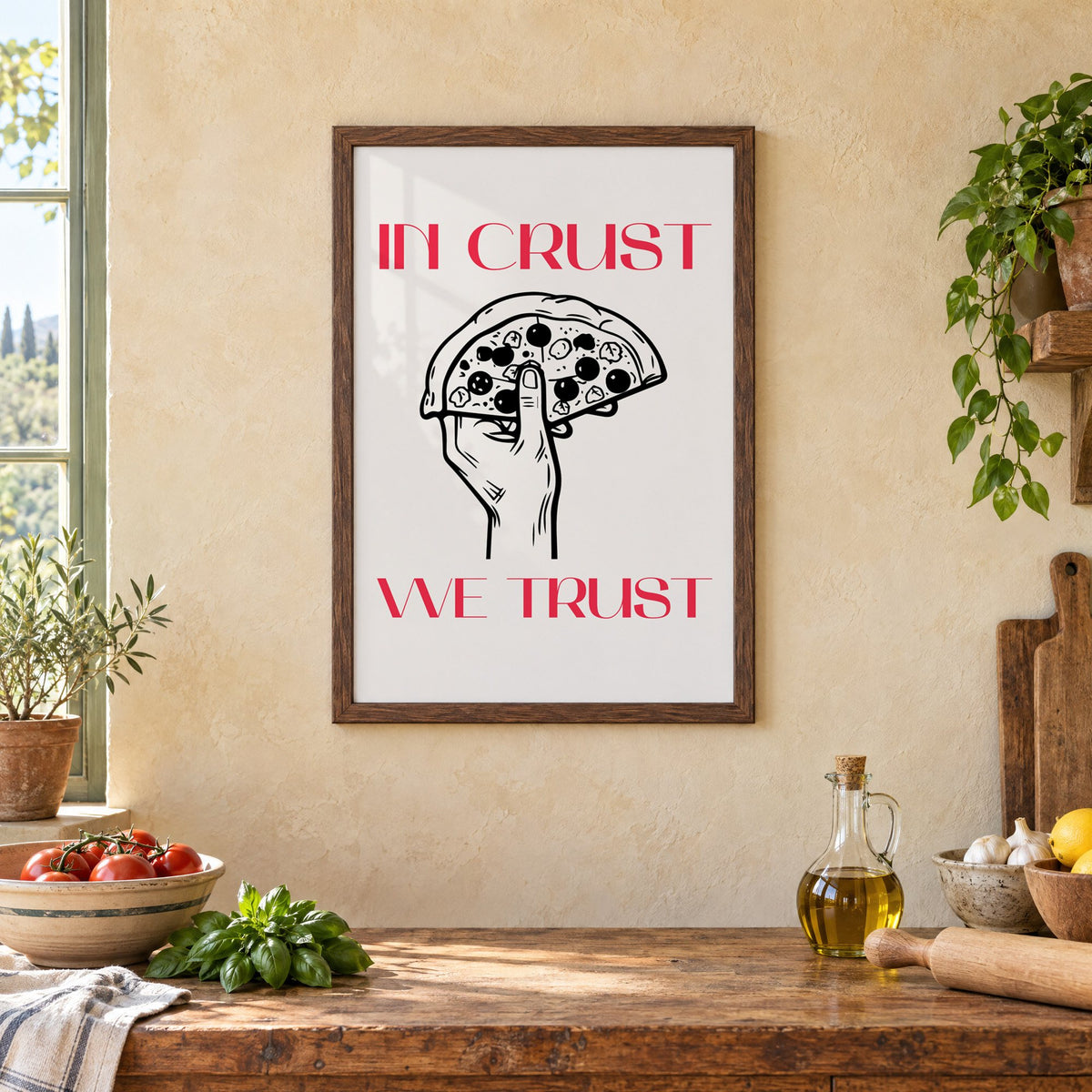 In Crust We Trust pizza print in a walnut frame above a rustic Italian kitchen table with tomatoes