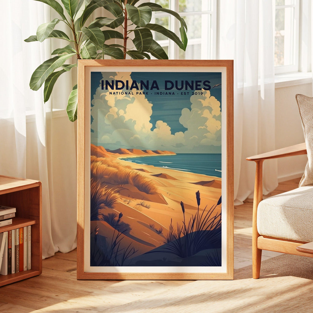 Indiana Dunes National Park print in an oak frame by a sunlit window with sheer curtains and a fig plant