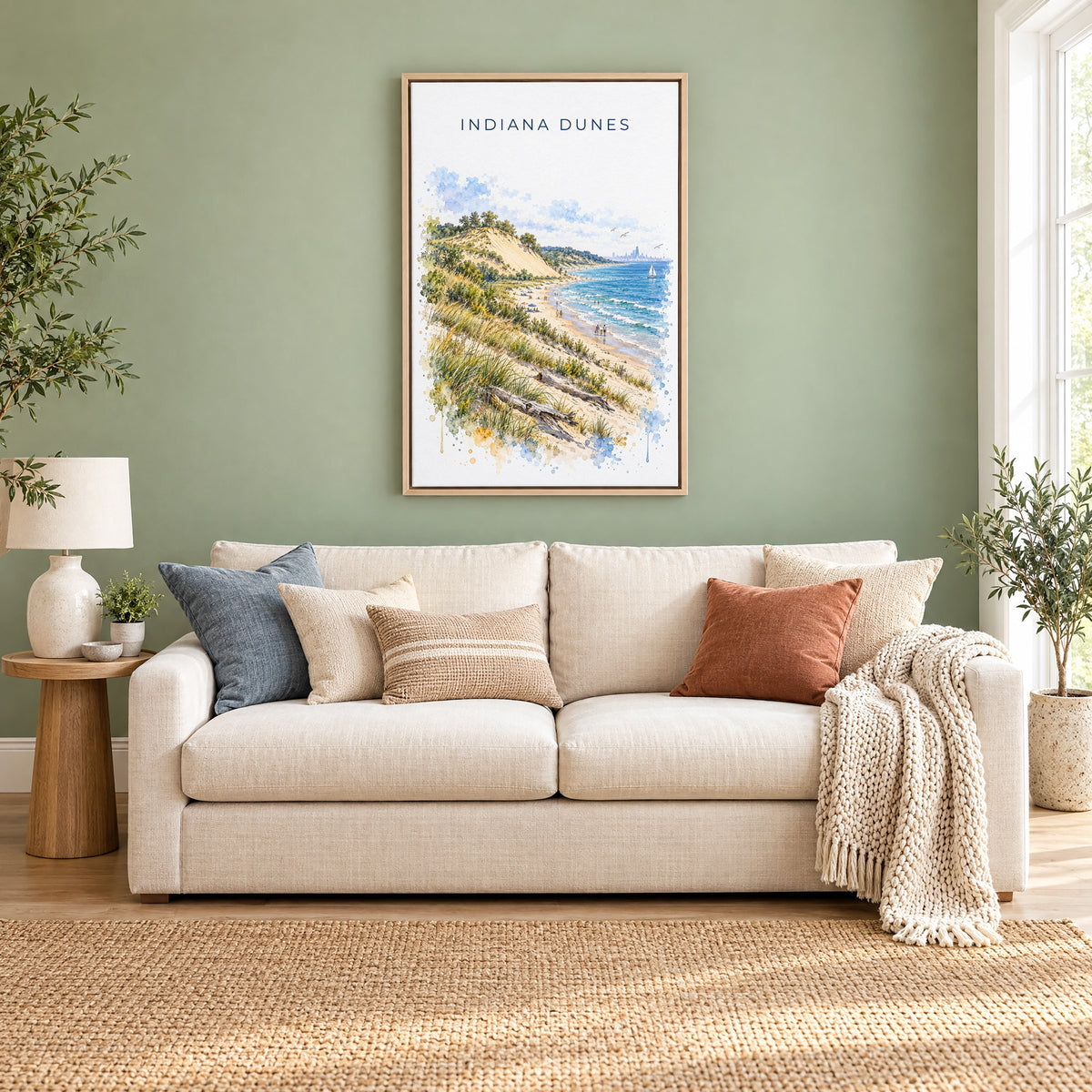 Indiana Dunes National Park watercolor print as a natural floater canvas above a cream linen sofa on a sage green wall