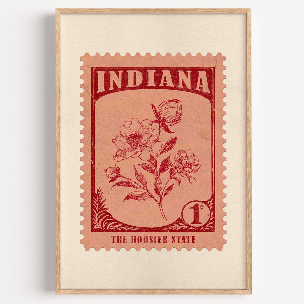 Indiana state flower stamp print in deep crimson on salmon, light oak frame on a plain white wall