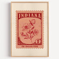 Indiana state flower stamp print in deep crimson on salmon, light oak frame on a plain white wall