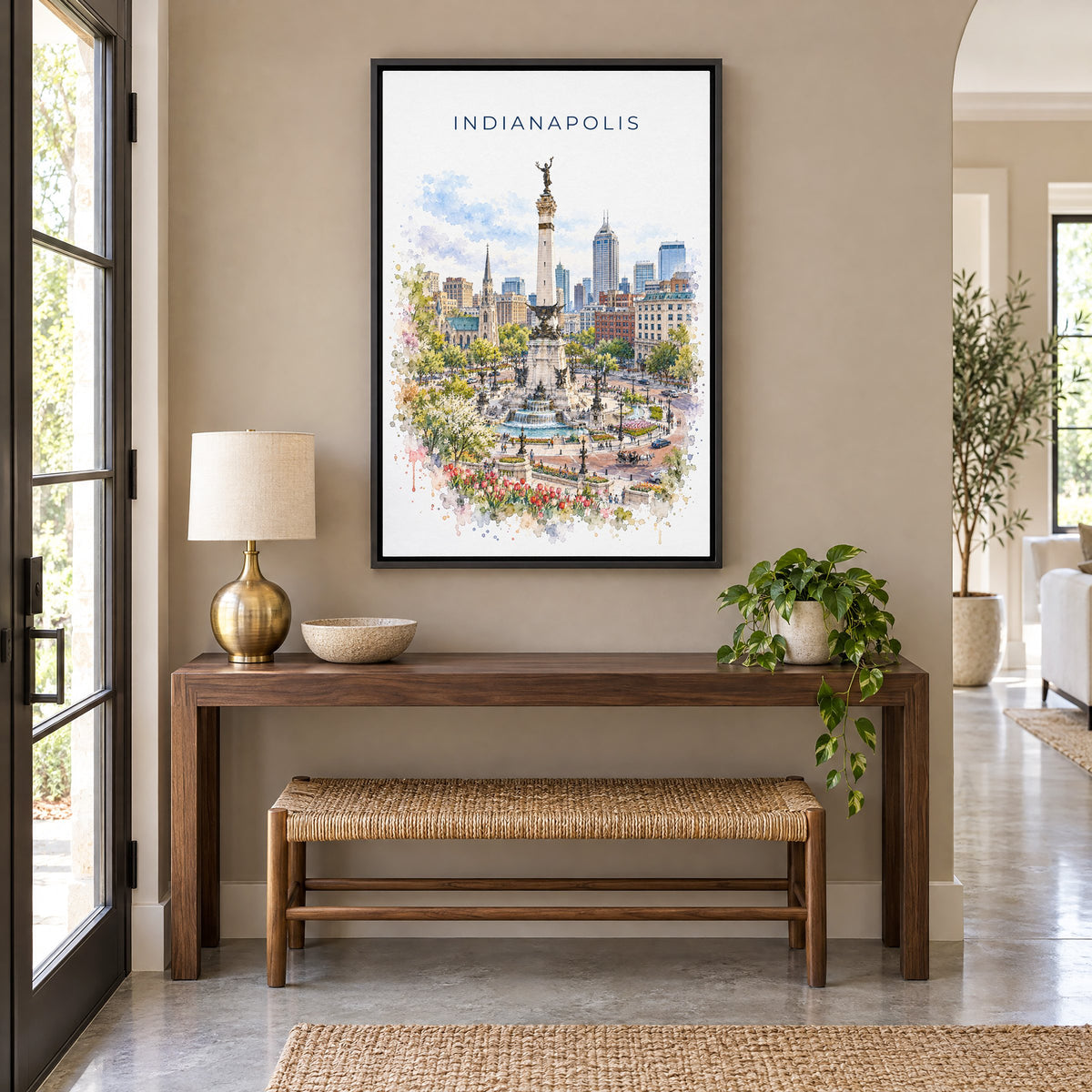 Indianapolis watercolor print as a black floater canvas above a walnut console and woven bench in an entryway