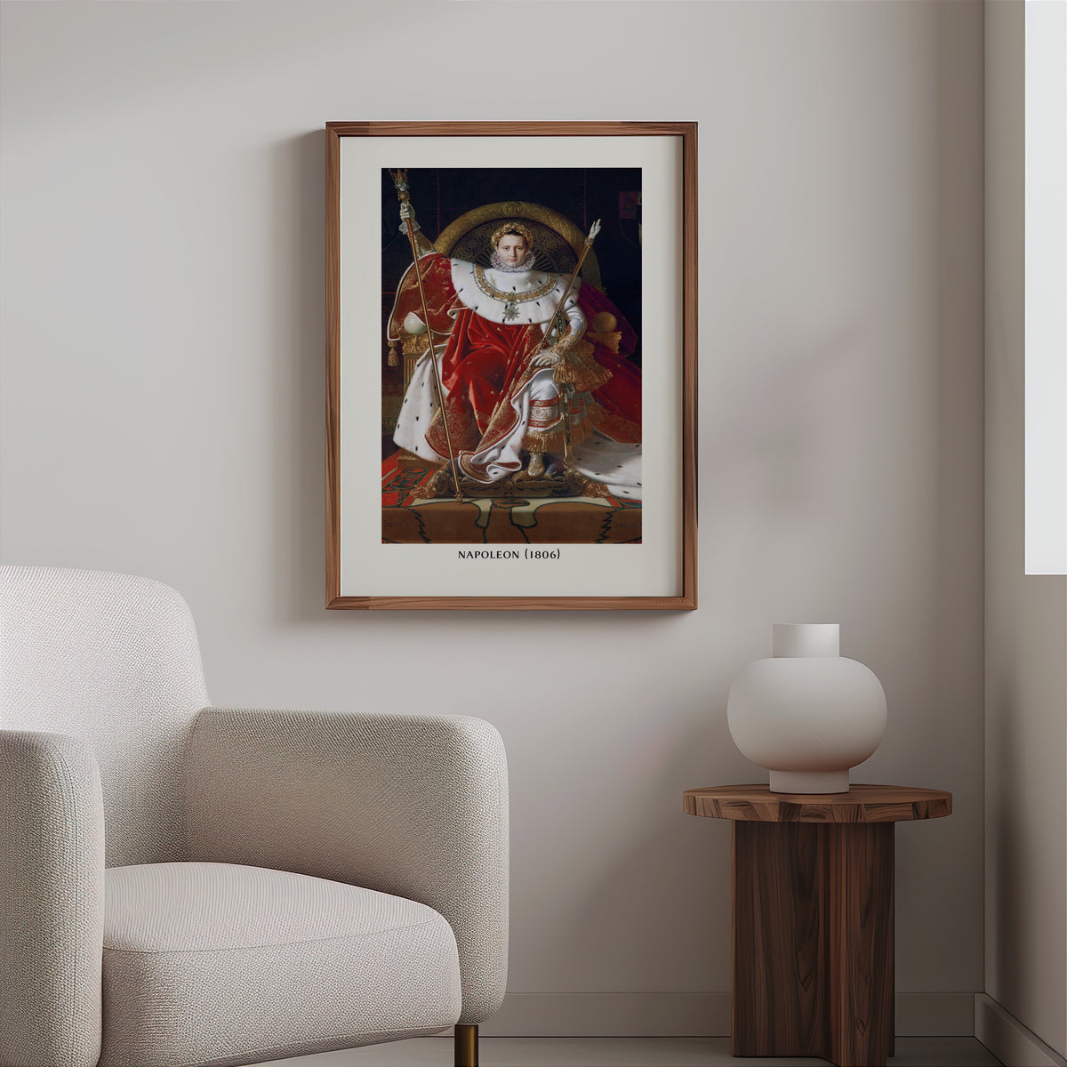 Neoclassical portrait print in a slim walnut frame above a bouclé armchair