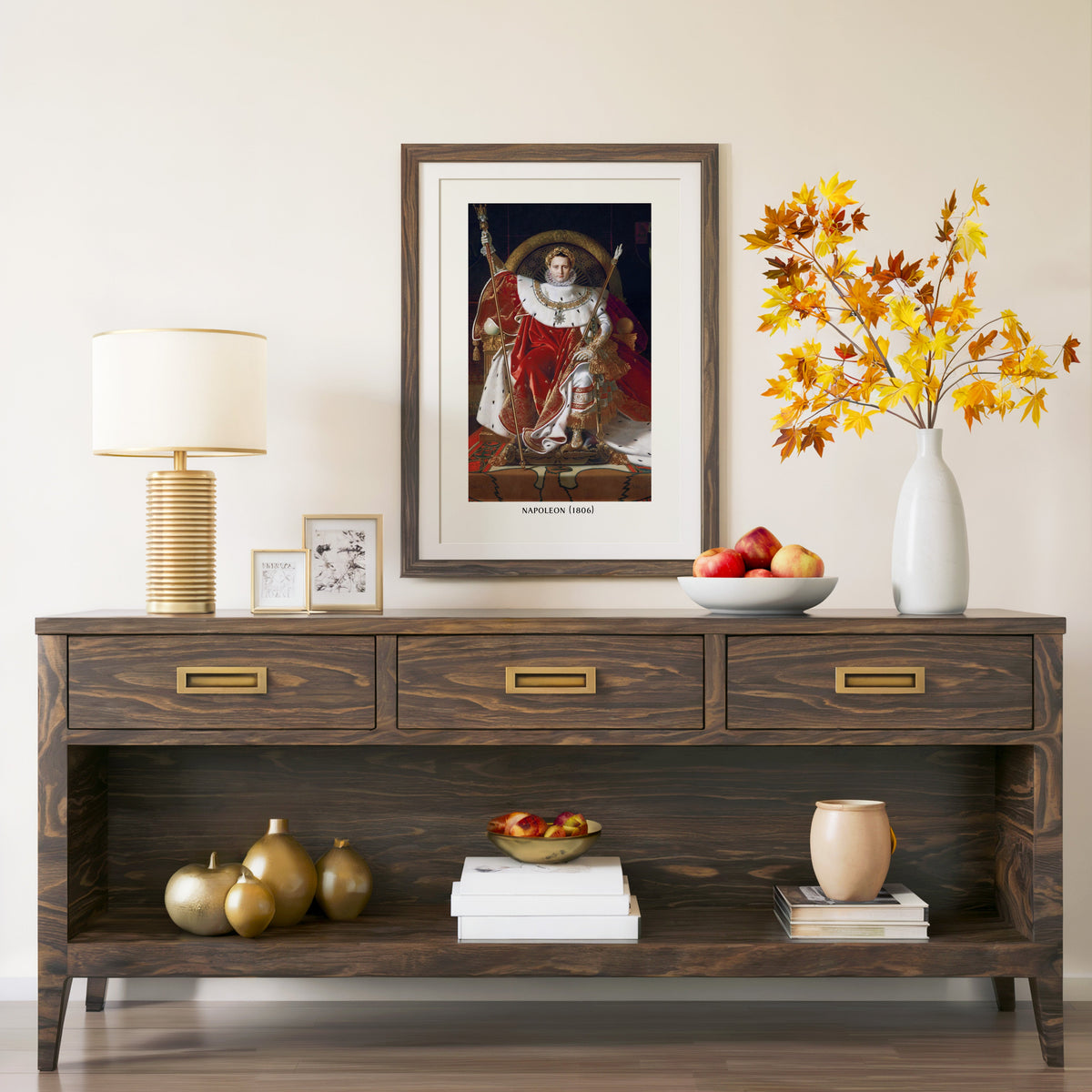 Napoleon on His Imperial Throne print in a walnut frame above a console with autumn branches