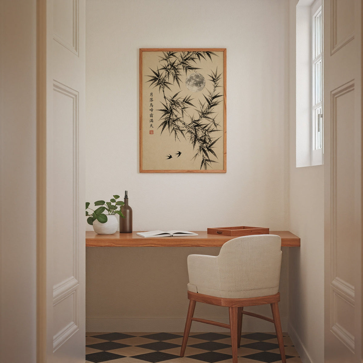 ink bamboo, full moon and swallows print in an oak frame above a wall-mounted desk in a home office nook