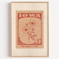 Iowa state flower stamp print in brick red on peach, light oak frame on a plain white wall