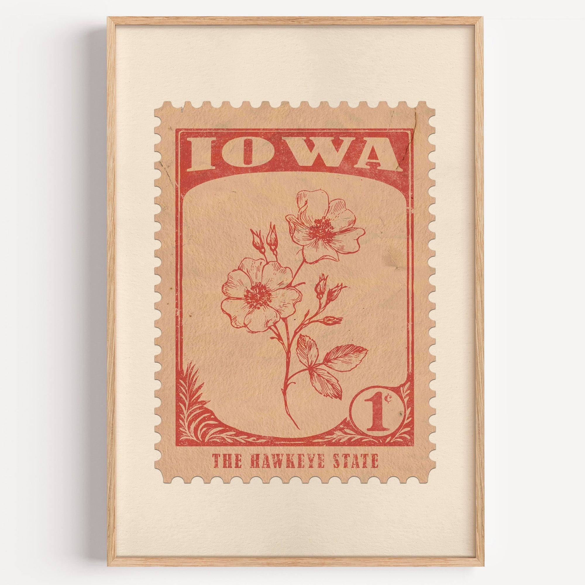 Iowa state flower stamp print in brick red on peach, light oak frame on a plain white wall