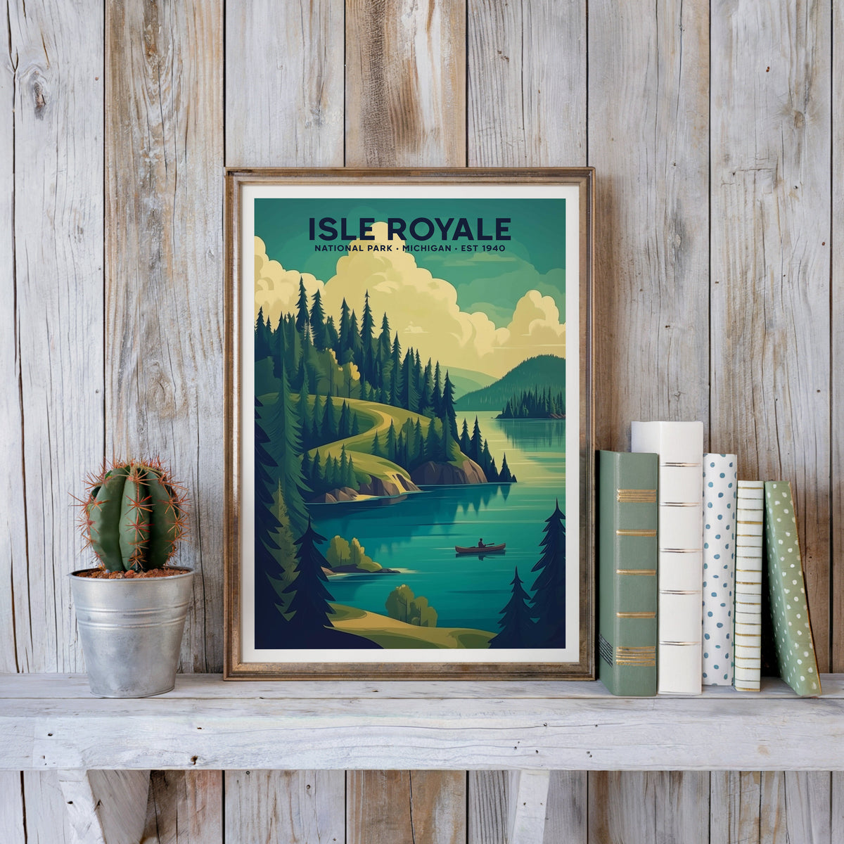 Isle Royale poster in an antique gold frame against whitewashed farmhouse planks beside books and a cactus