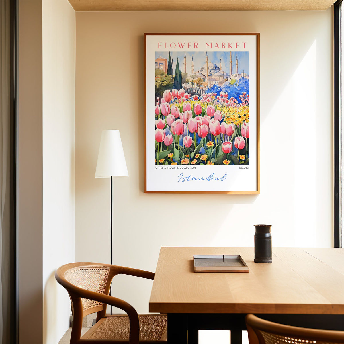 Istanbul flower market print in an oak frame above a dining table and cane chair