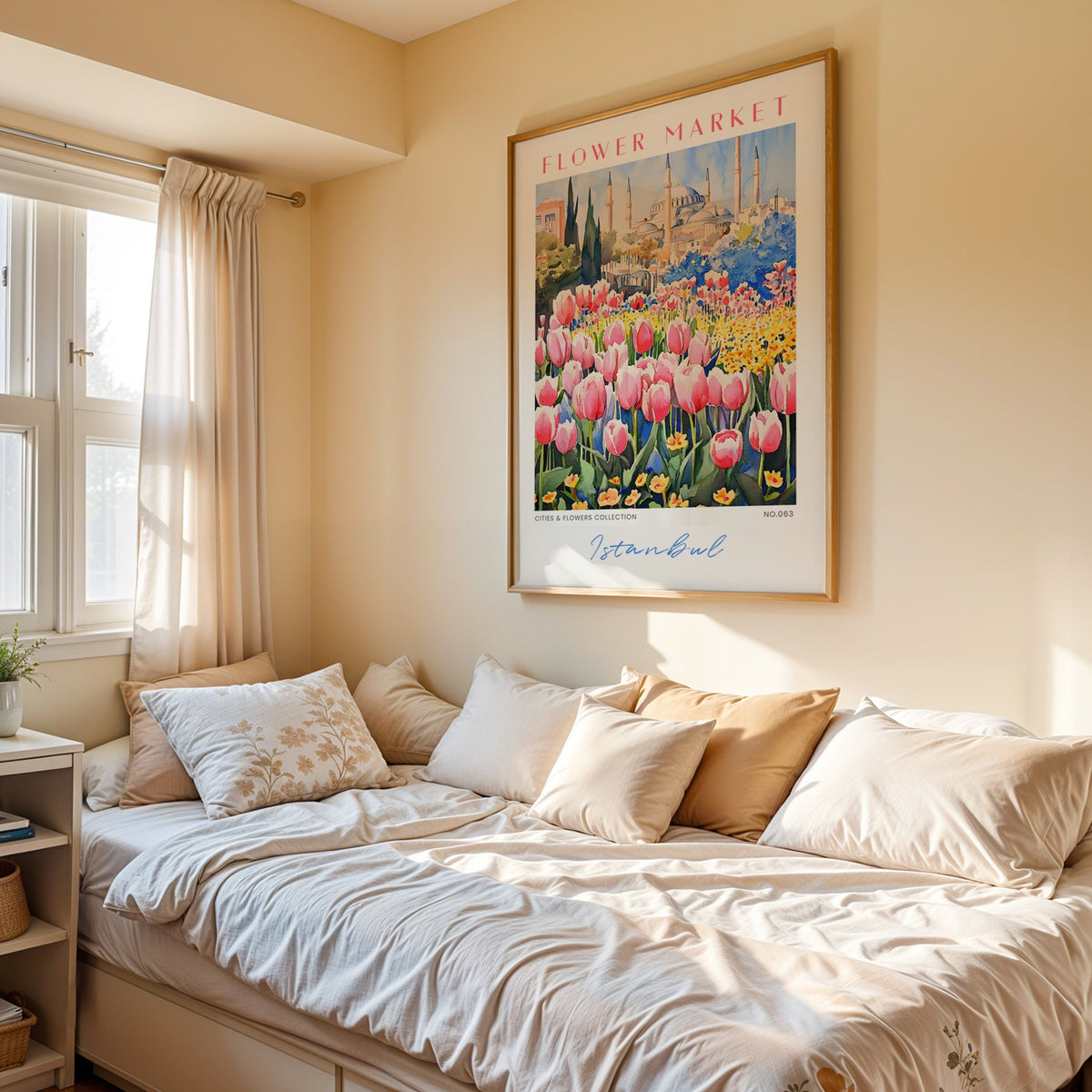 Istanbul flower market print in an oak frame above a cream daybed in a sunny bedroom