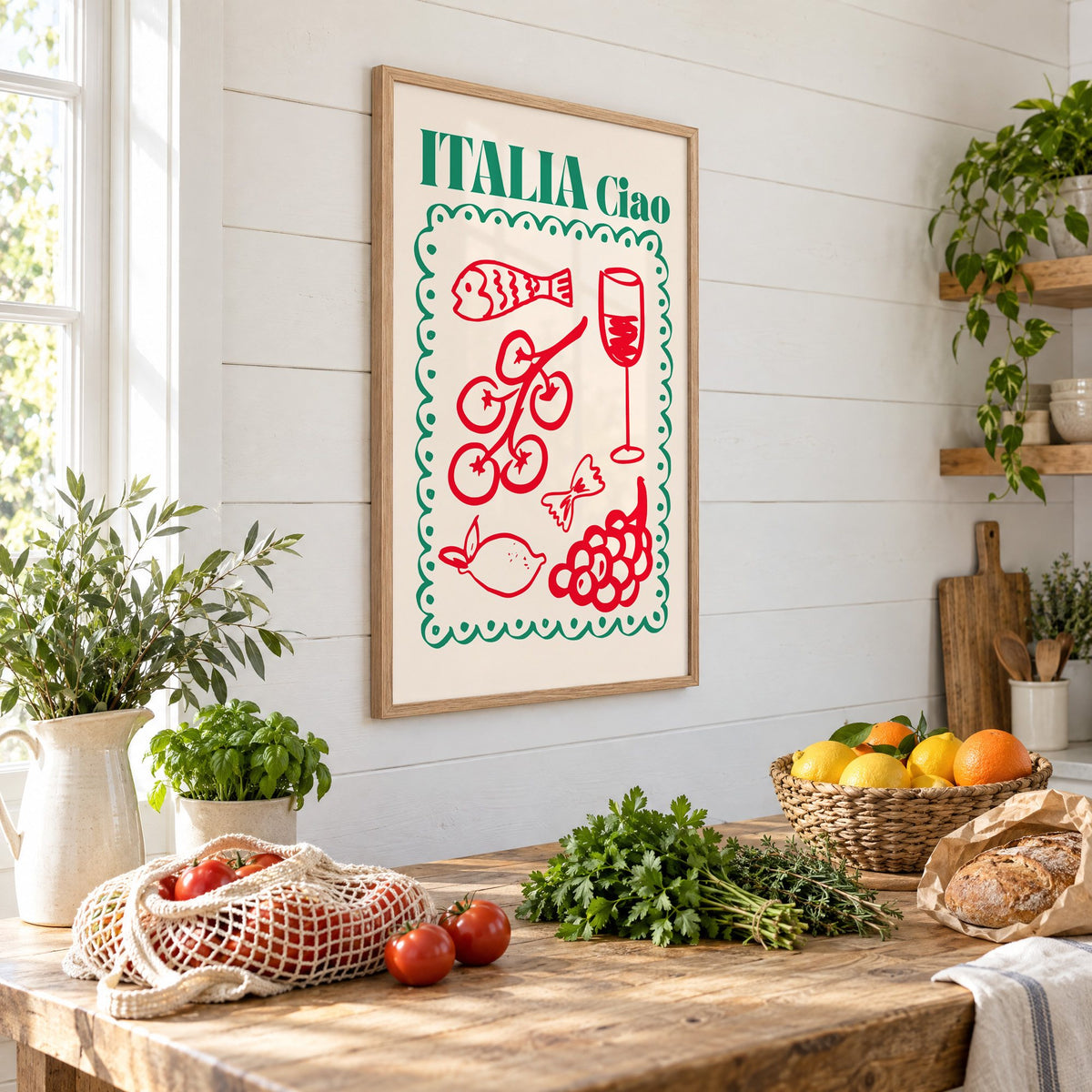 ITALIA Ciao red food doodles print in an oak frame on a shiplap wall above a farm table with market tomatoes and citrus, seen at an angle