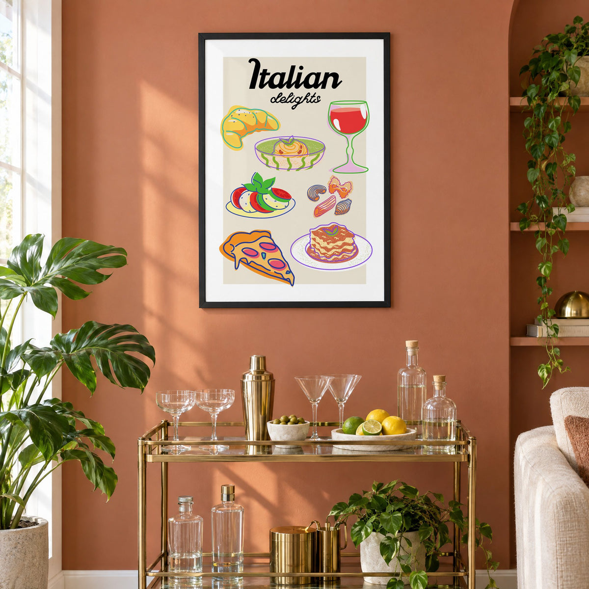 Italian delights colorful food doodle print in a black frame on a terracotta wall above a brass bar cart with coupes and citrus