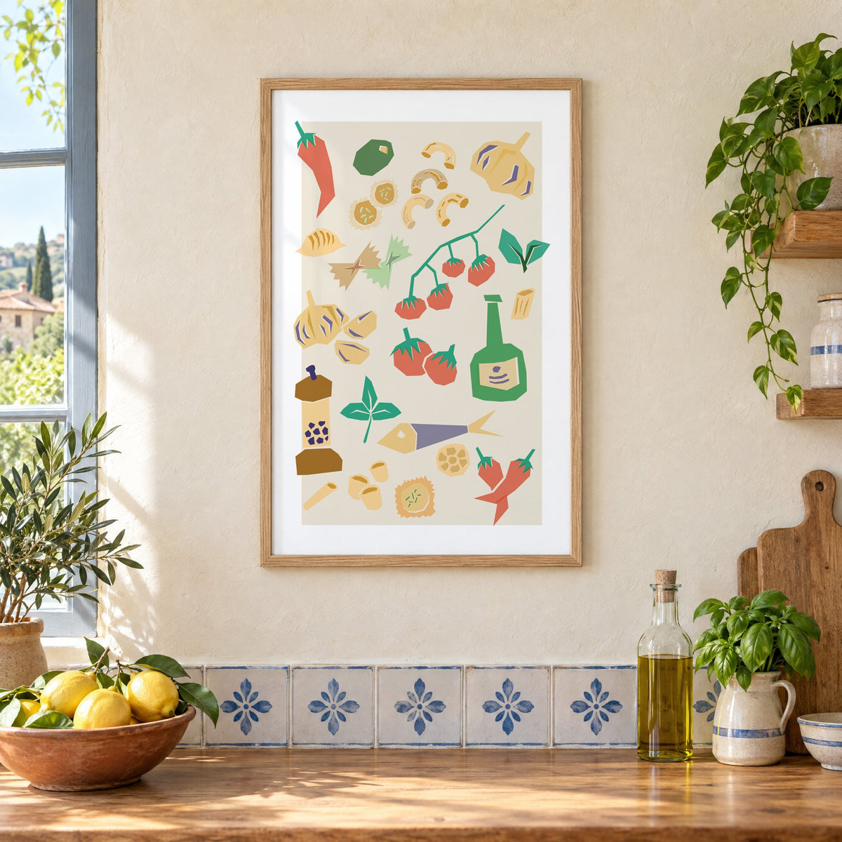 Italian ingredients cut-paper pattern print in an oak frame on a cream plaster wall above a worktop with a bowl of lemons and blue-and-white tiles