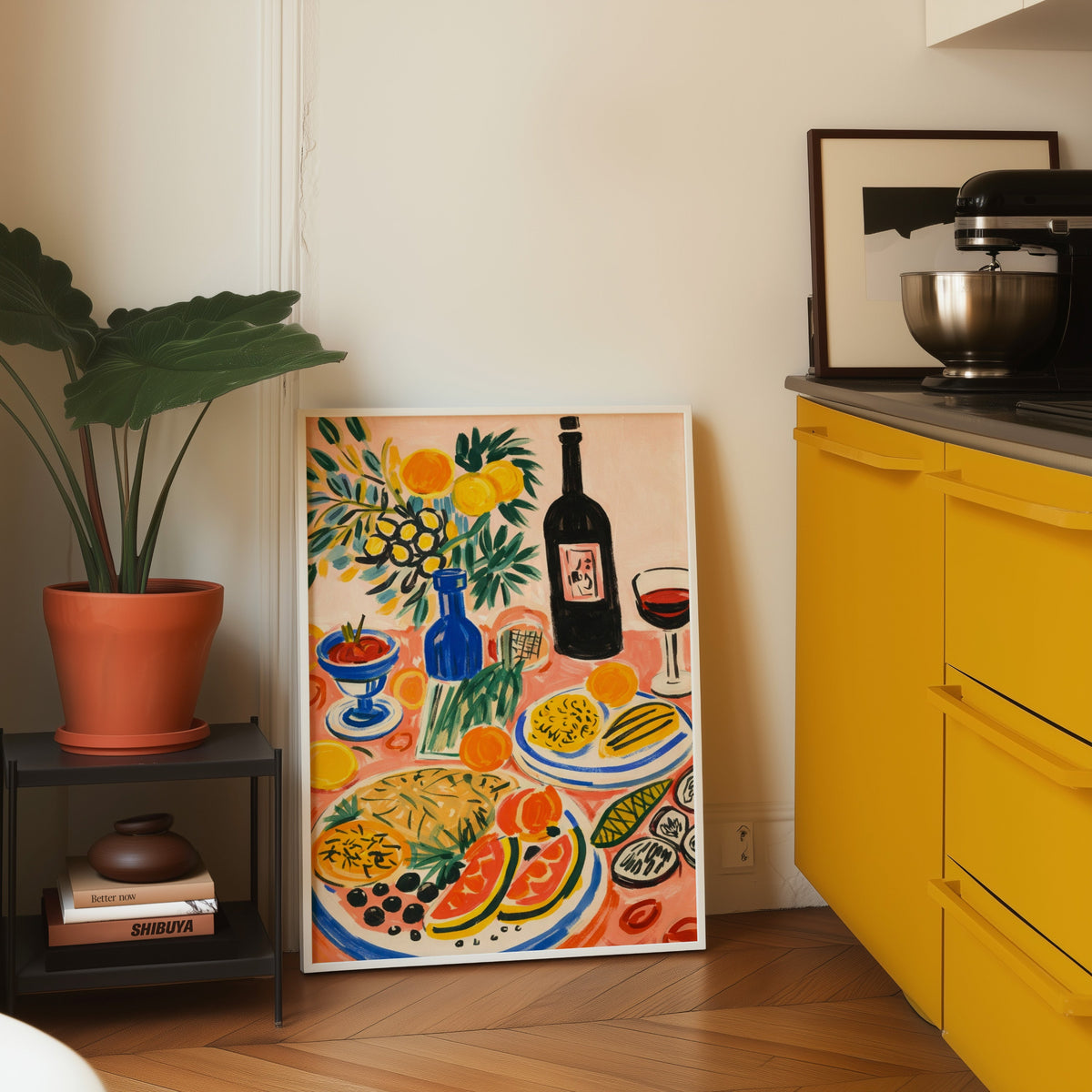Italian table print in a white frame leaning on parquet beside a yellow kitchen