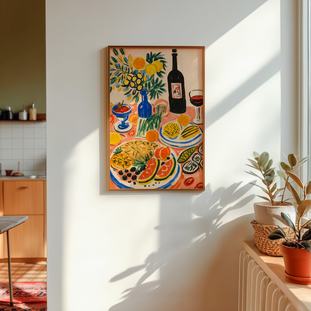 Italian table print in a gold frame in sunlight with plants and a kitchen beyond
