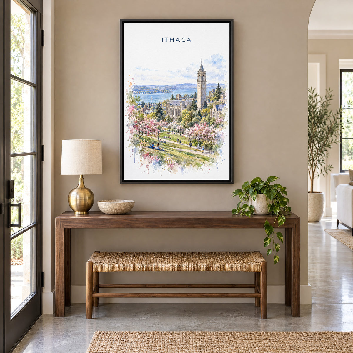 Ithaca watercolor print as a black floater canvas above a walnut console and woven bench in an entryway