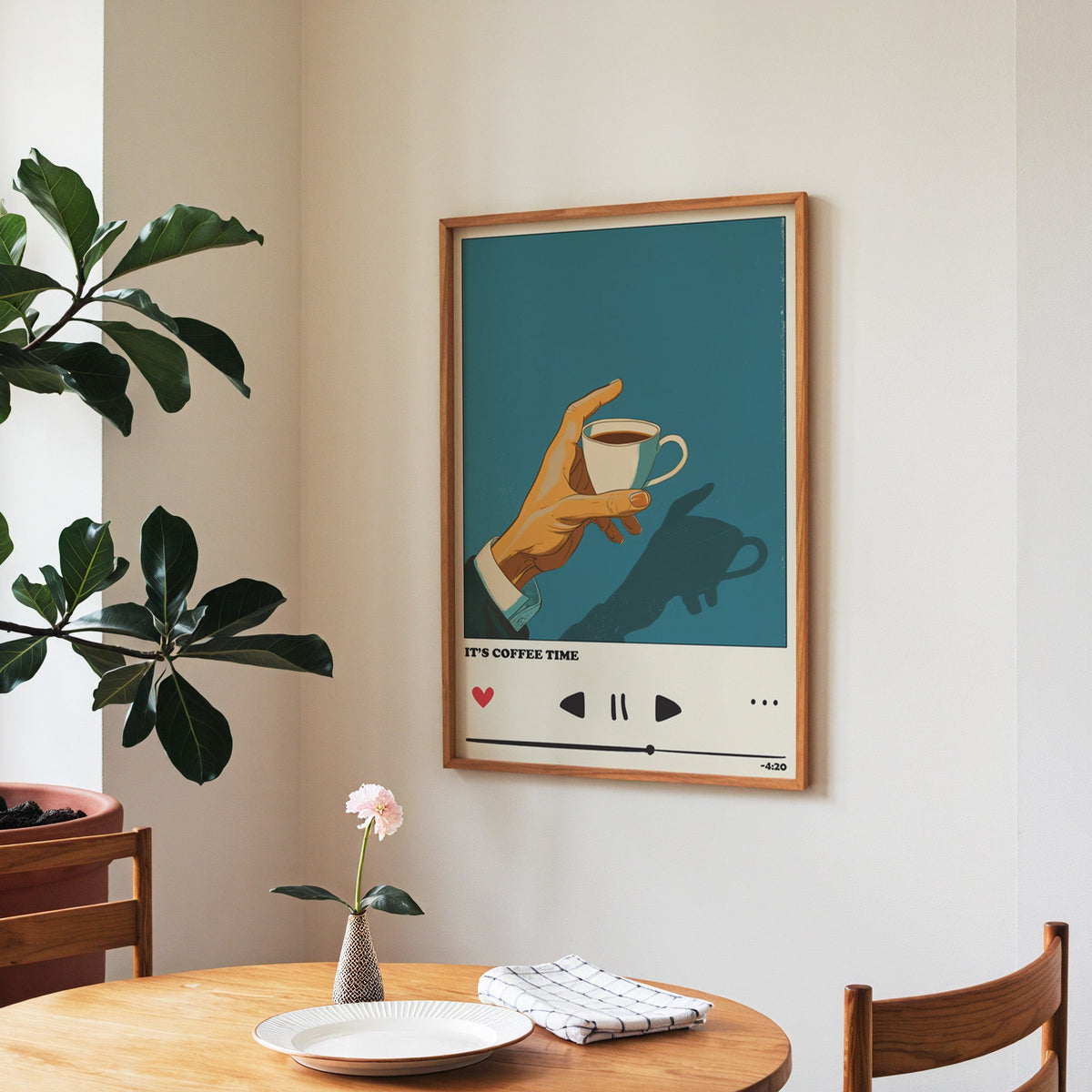 It's Coffee Time print in a walnut frame above a round table beside a fiddle-leaf fig