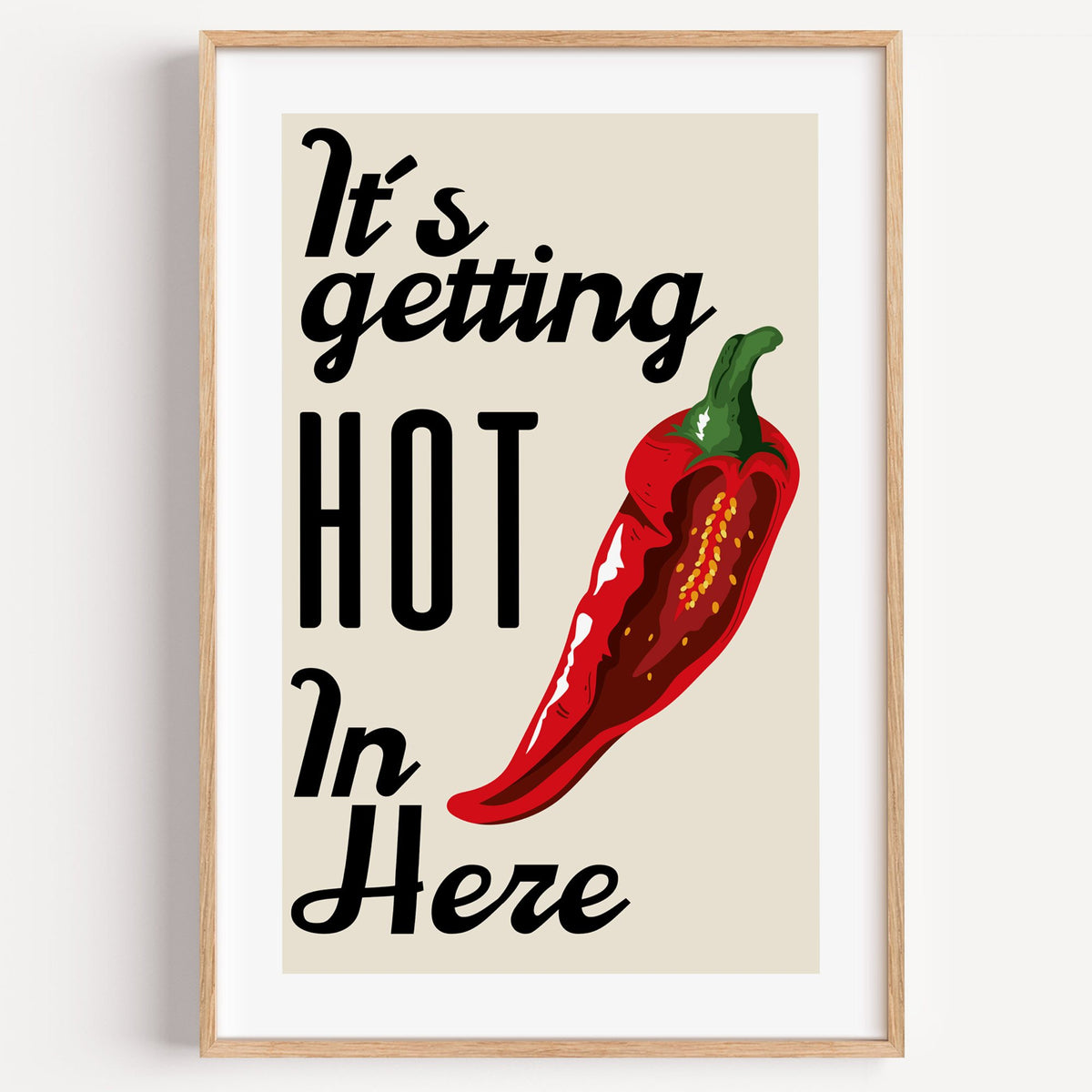 It's getting HOT In Here split chili print in a light oak frame on a plain white wall