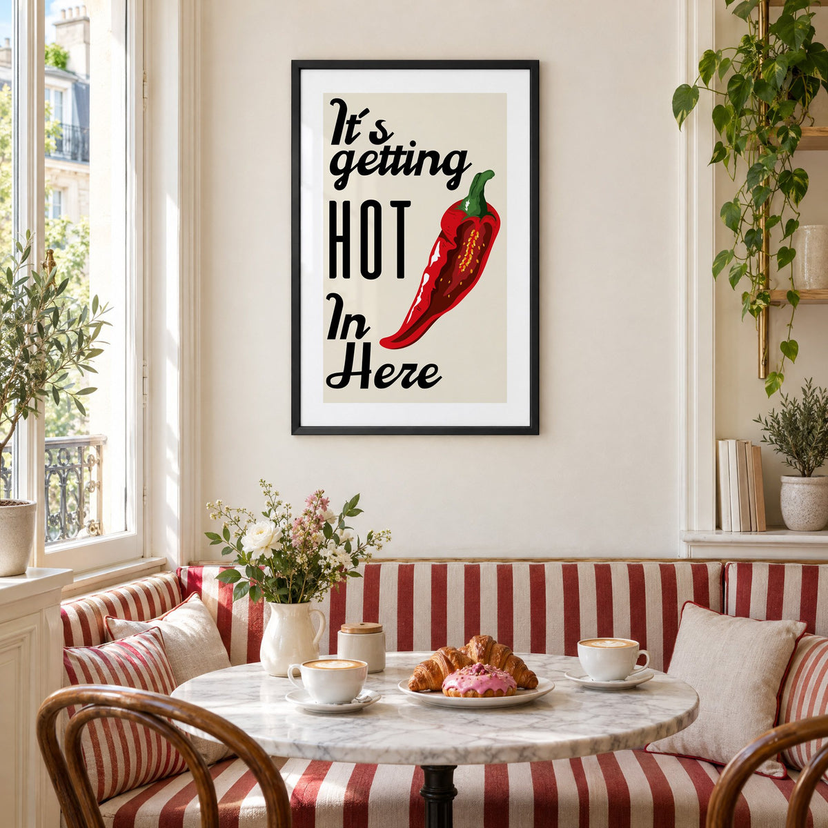 It's getting HOT In Here split chili print in a black frame above a striped cafe breakfast nook with cappuccino and pastries