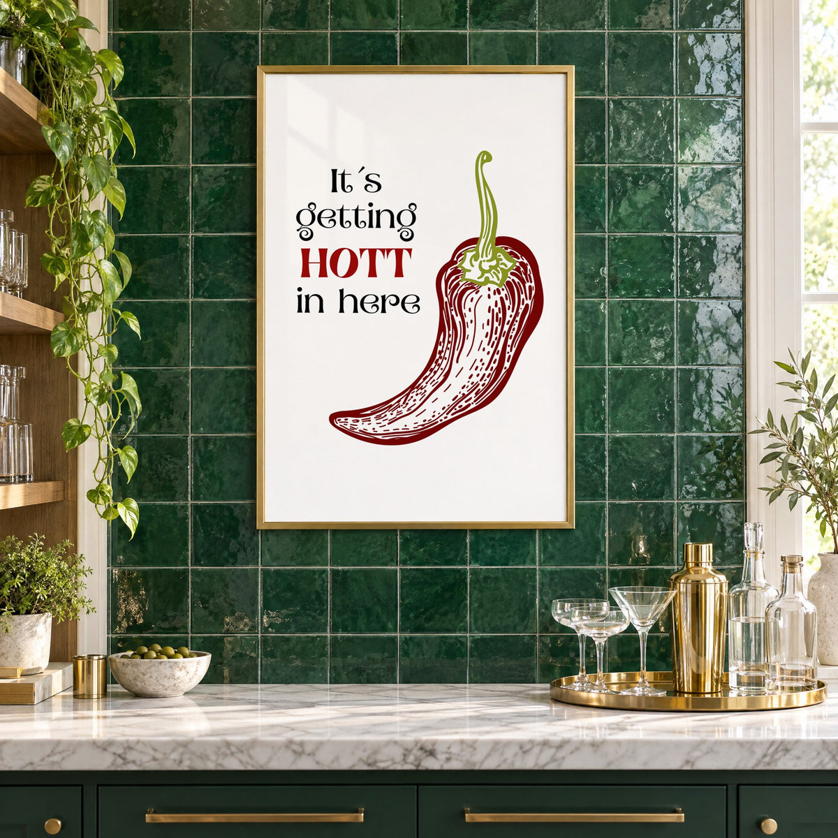 It's getting HOTT red chili print in a brass frame on emerald green tiles above a home bar with coupe glasses