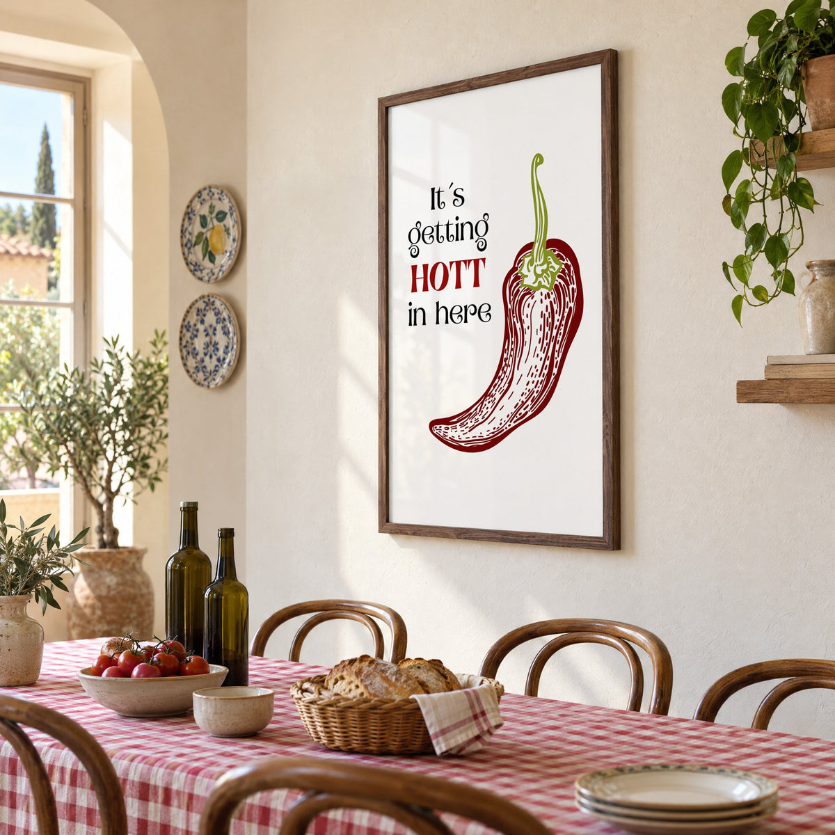 It's getting HOTT red chili print in a walnut frame above a gingham-covered trattoria table, seen at an angle