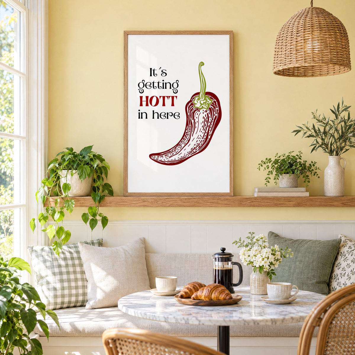It's getting HOTT red chili print in an oak frame on a picture ledge above a sunny breakfast nook