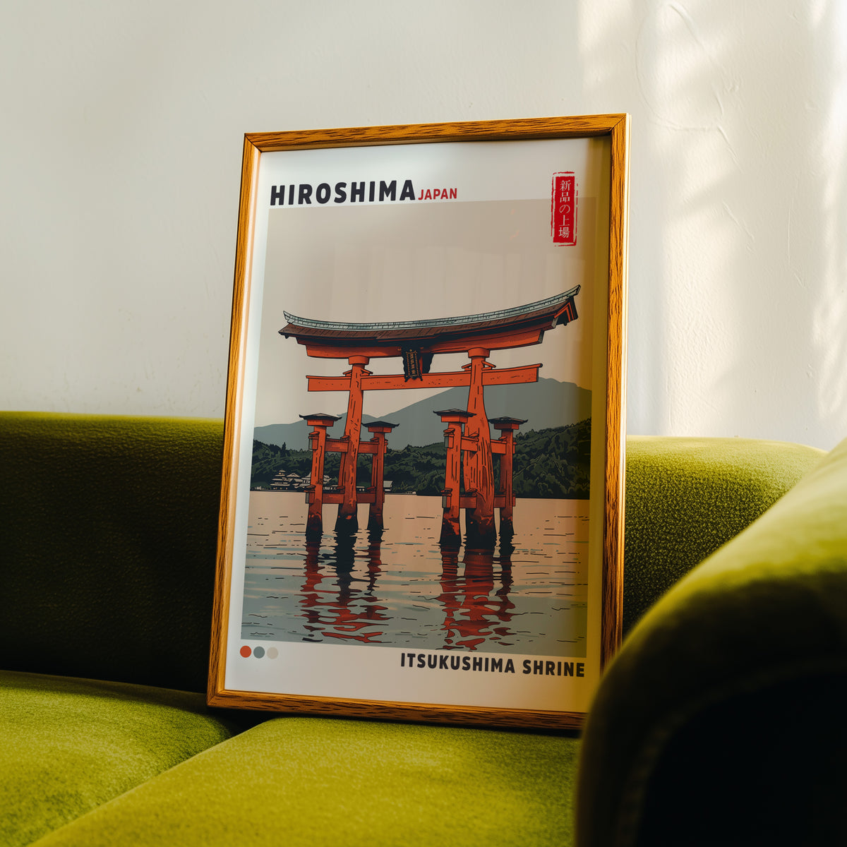 Retro Itsukushima torii gate print in an oak frame propped on a green velvet sofa