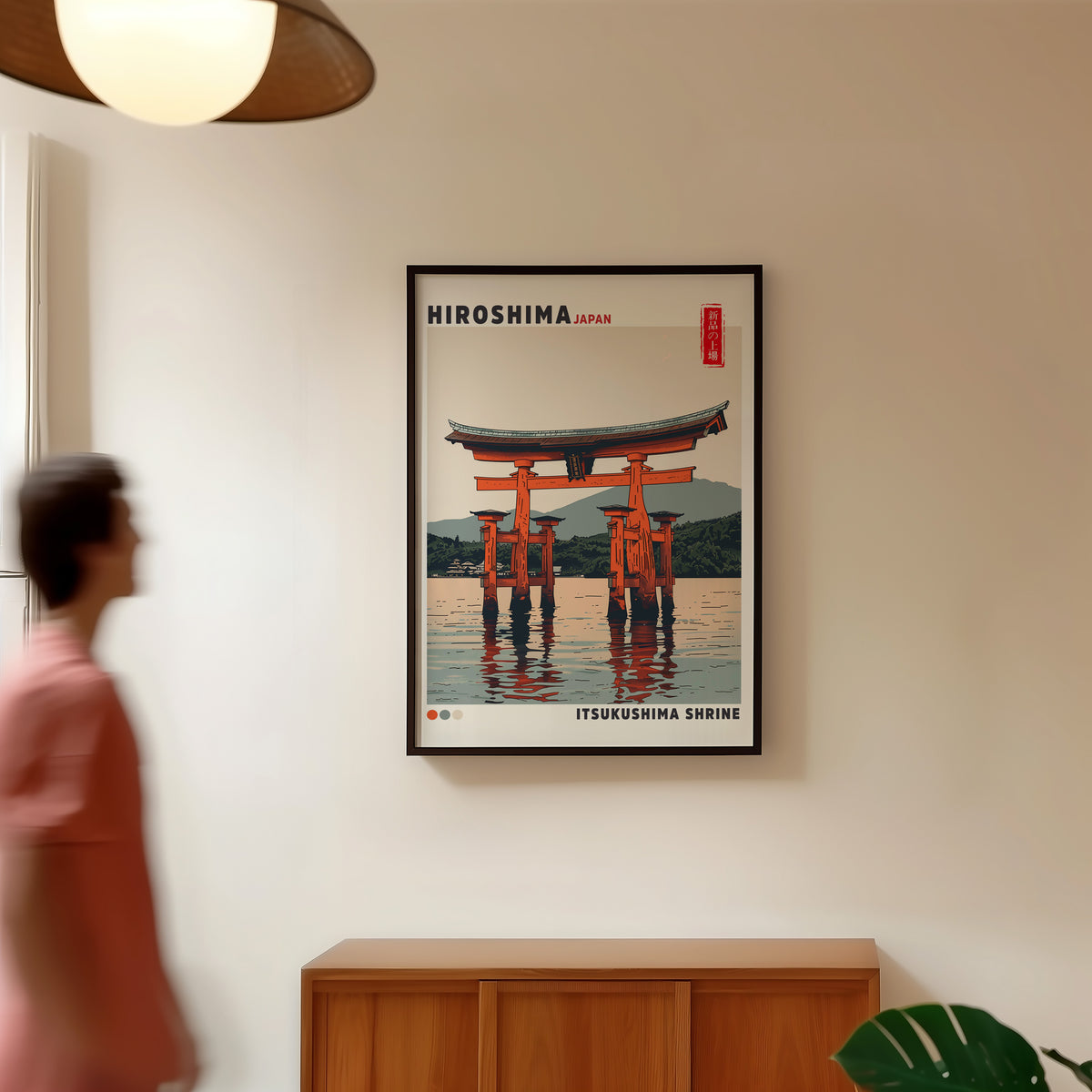 Retro Itsukushima torii gate print in a black frame in a hallway under a rattan pendant