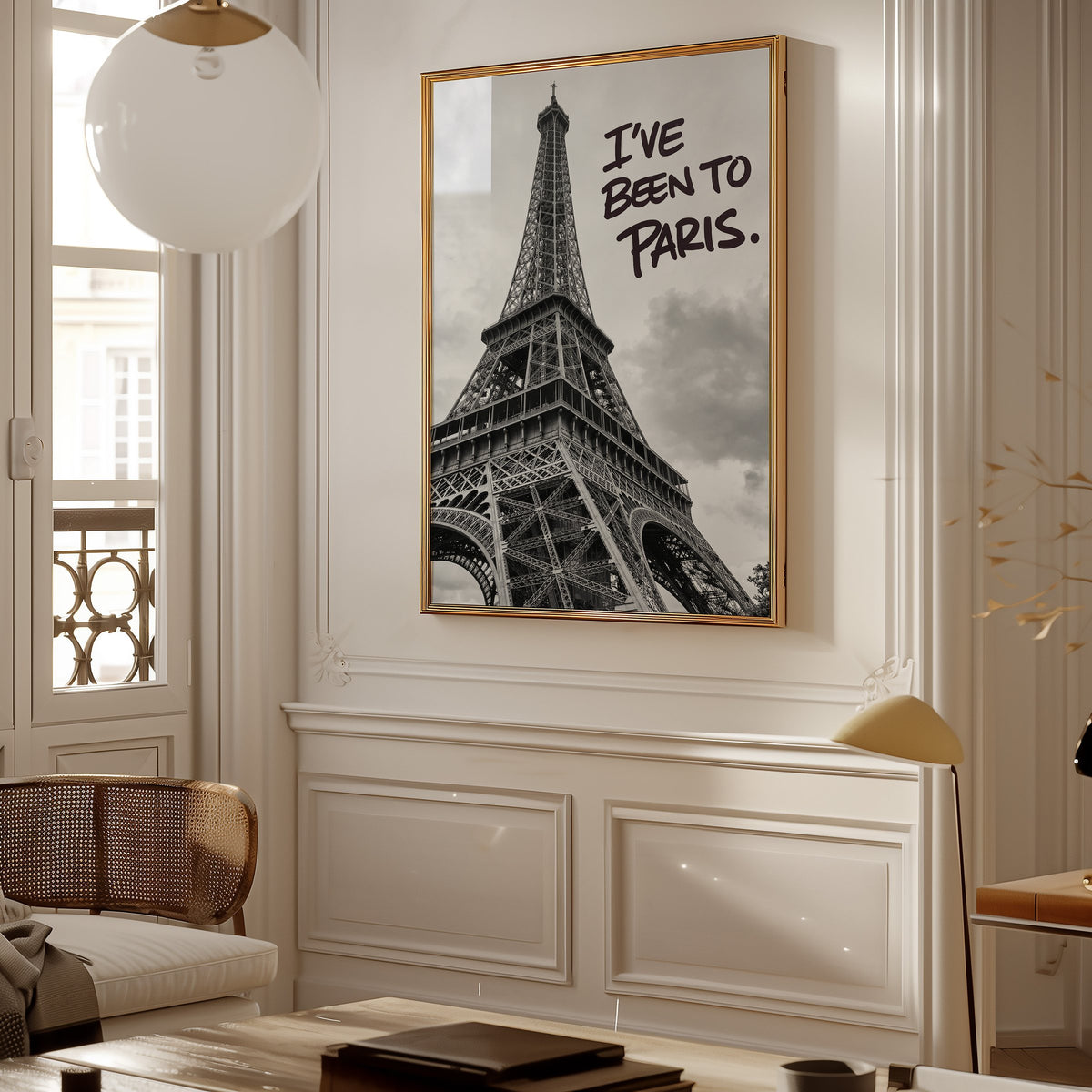 I've Been to Paris handwritten quote on Eiffel photo print shown in a gold frame in a Parisian paneled living room