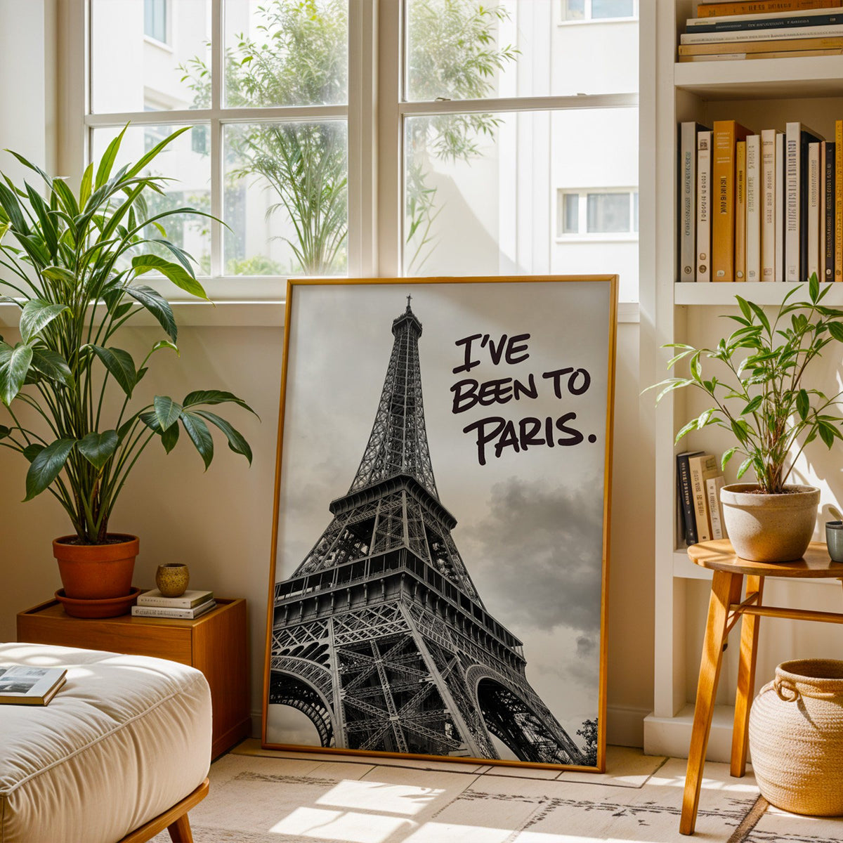 I've Been to Paris handwritten quote on Eiffel photo print shown in a brass frame leaning on a sunlit living room floor