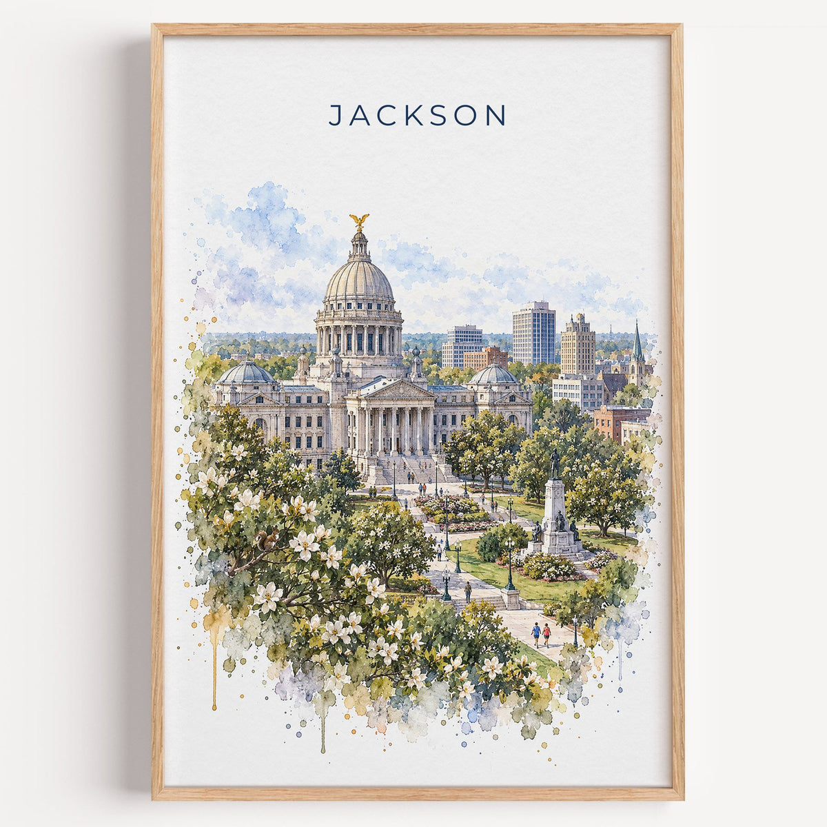 Jackson, Mississippi watercolor print in a light oak frame on a plain white wall
