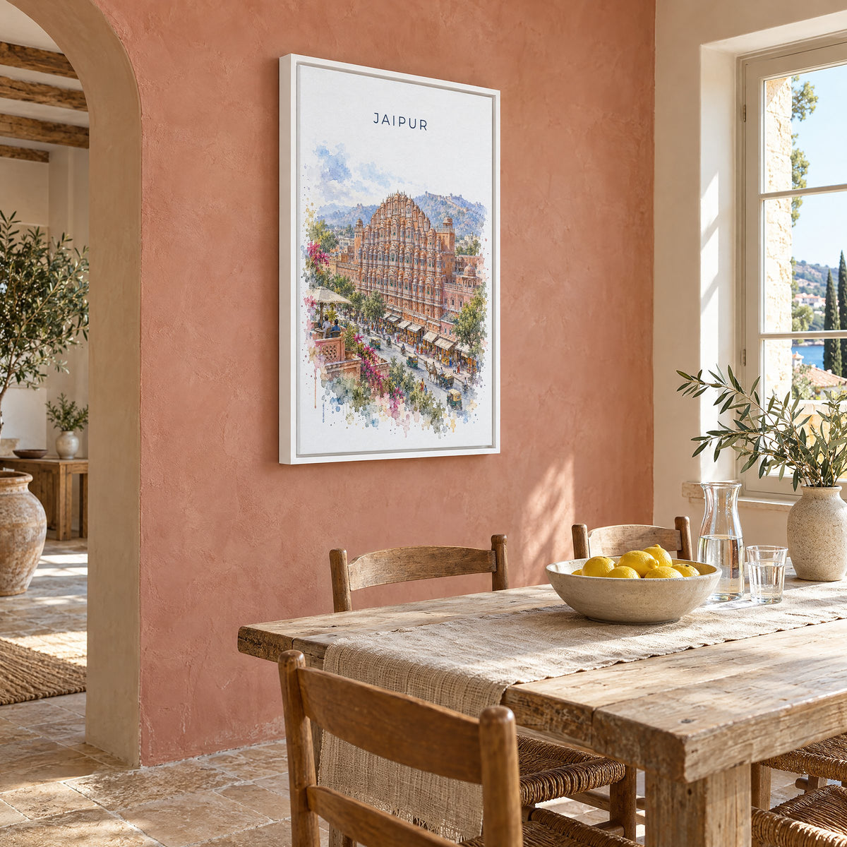 Jaipur watercolor print as a white floater canvas on a terracotta wall above a rustic dining table