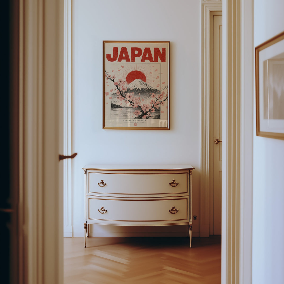 engraved Mount Fuji with sakura print shown in a gold frame in a hallway above a cream dresser