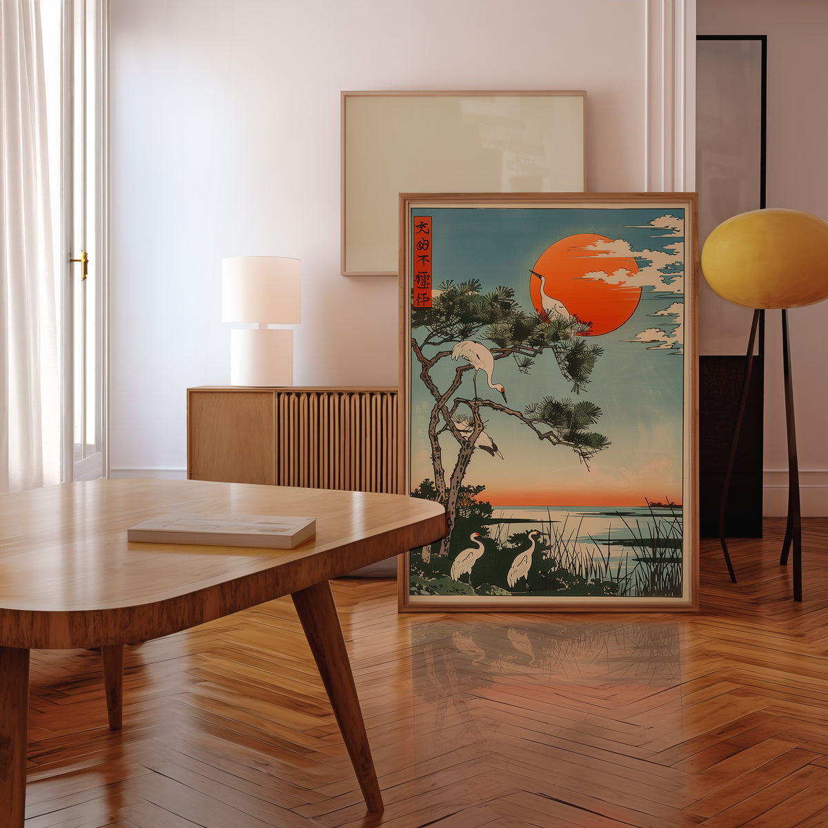 Cranes on pine with orange sun print in a walnut frame leaning in a mid-century living room