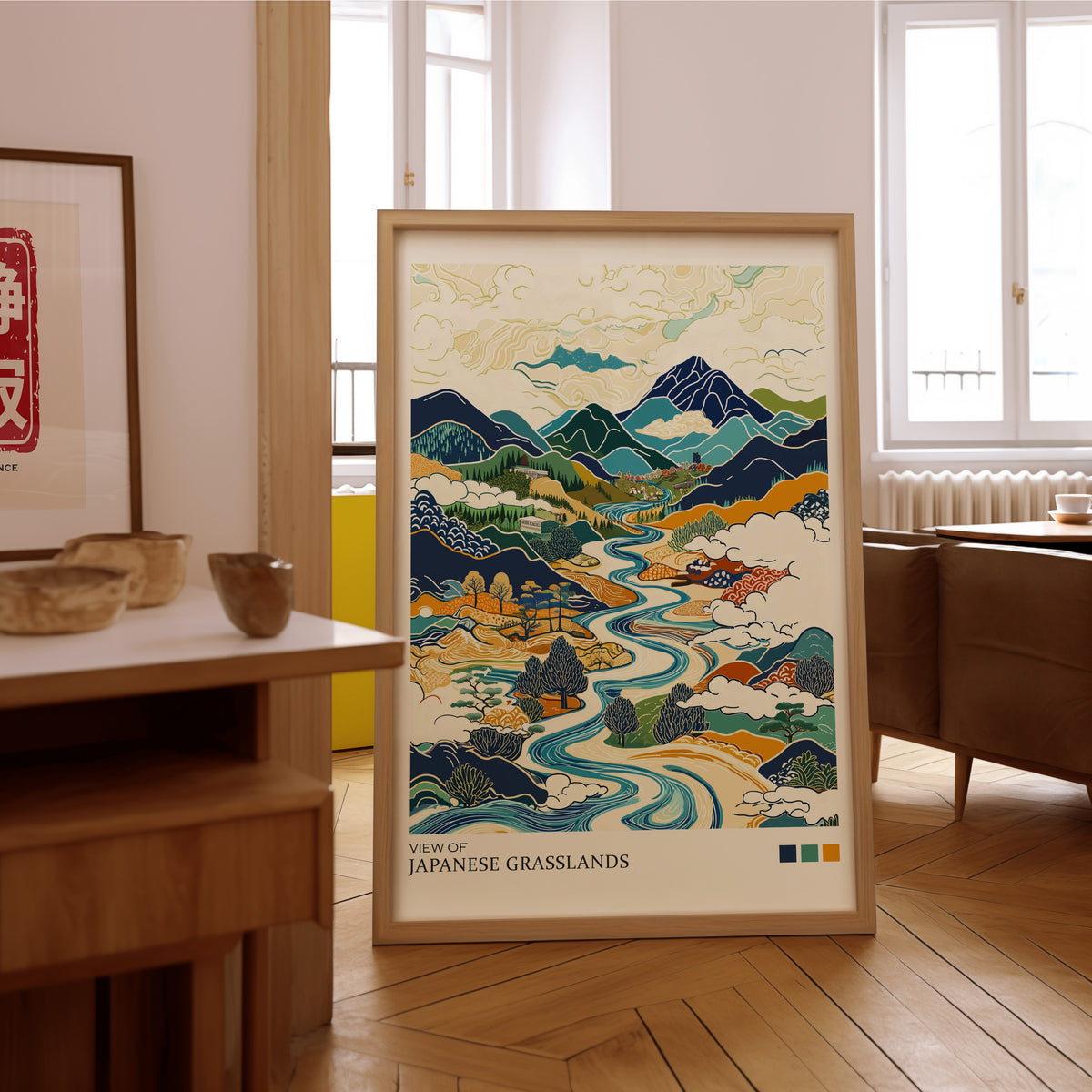 View of Japanese Grasslands river valley print in an oak frame on the parquet floor of a sunlit living room