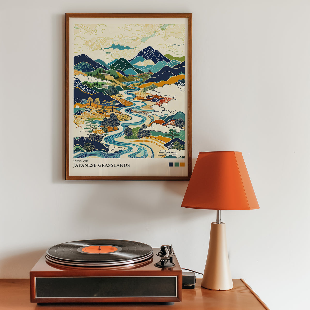 View of Japanese Grasslands river valley print in a walnut frame above a sideboard with a record player