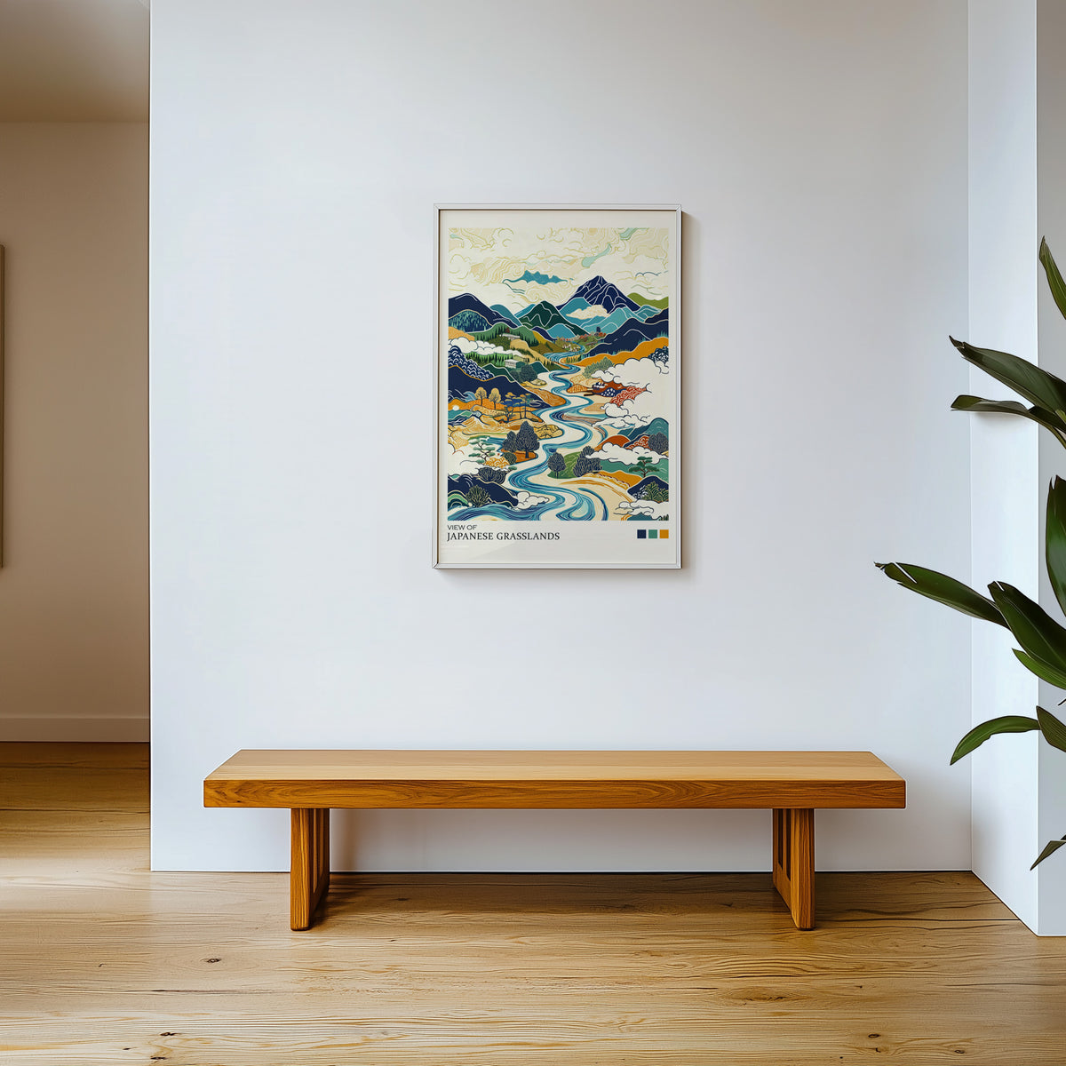 View of Japanese Grasslands river valley print shown in a white frame above a wooden entryway bench
