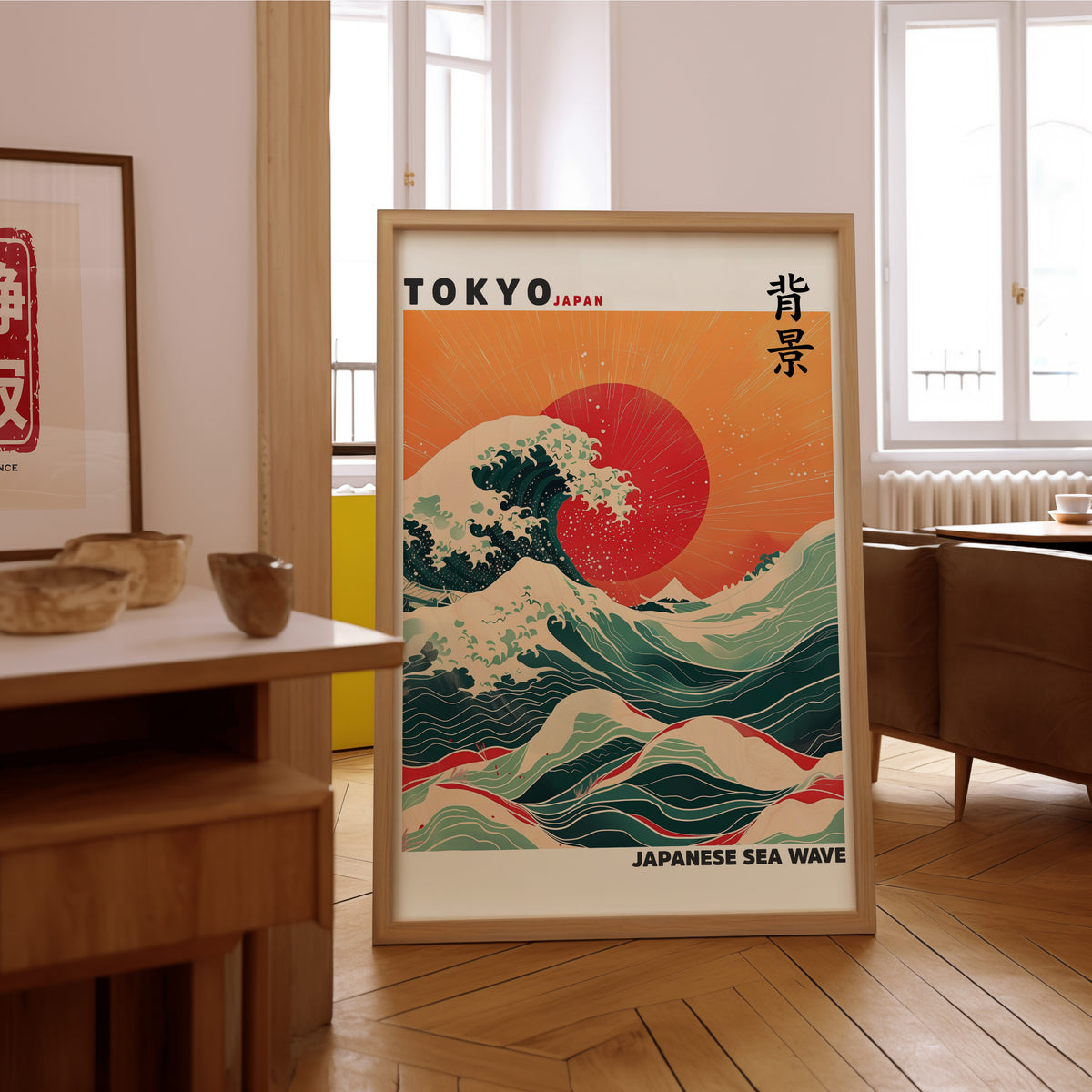 Japanese sea wave red sun print in an oak frame on the parquet floor of a sunlit living room