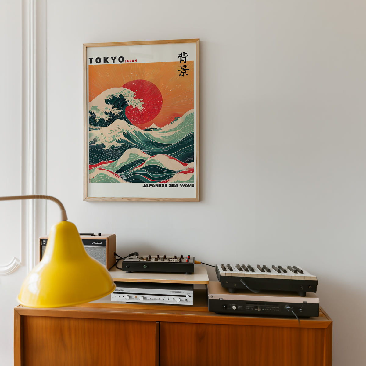 Japanese sea wave red sun print in an oak frame above a teak sideboard with vintage hi-fi