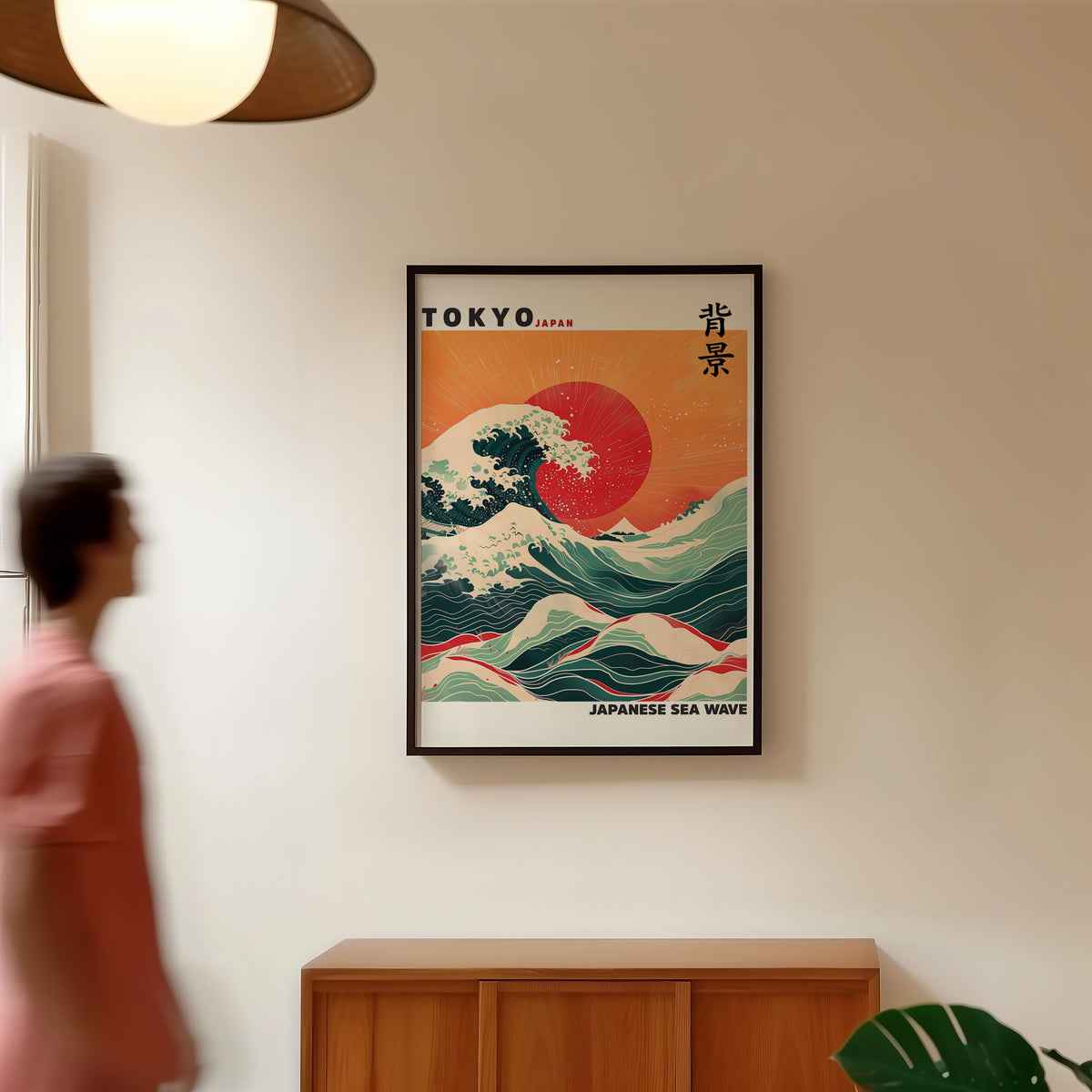Japanese sea wave red sun print in a black frame in a hallway under a rattan pendant
