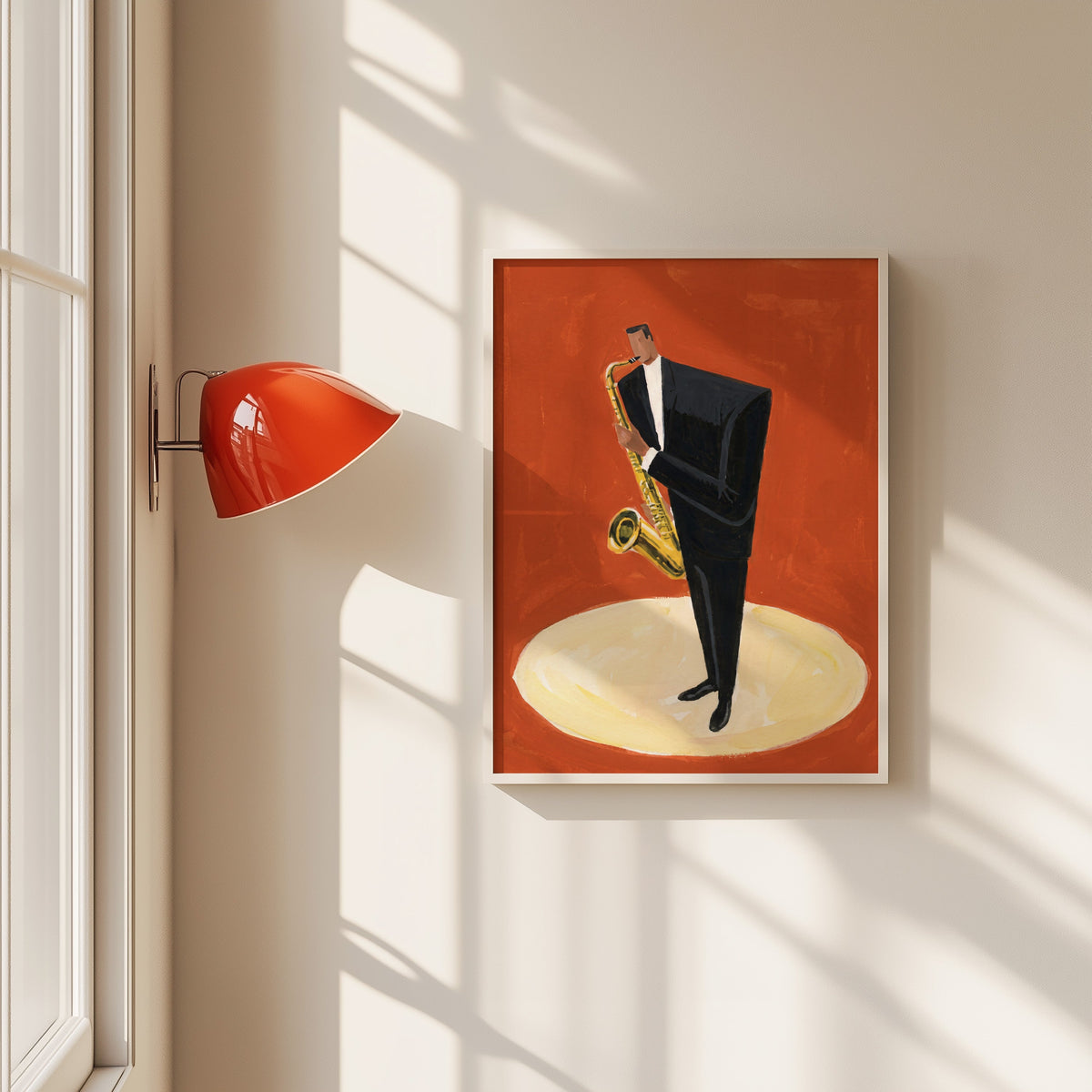 Jazz saxophone player print in a white frame beside a red wall sconce