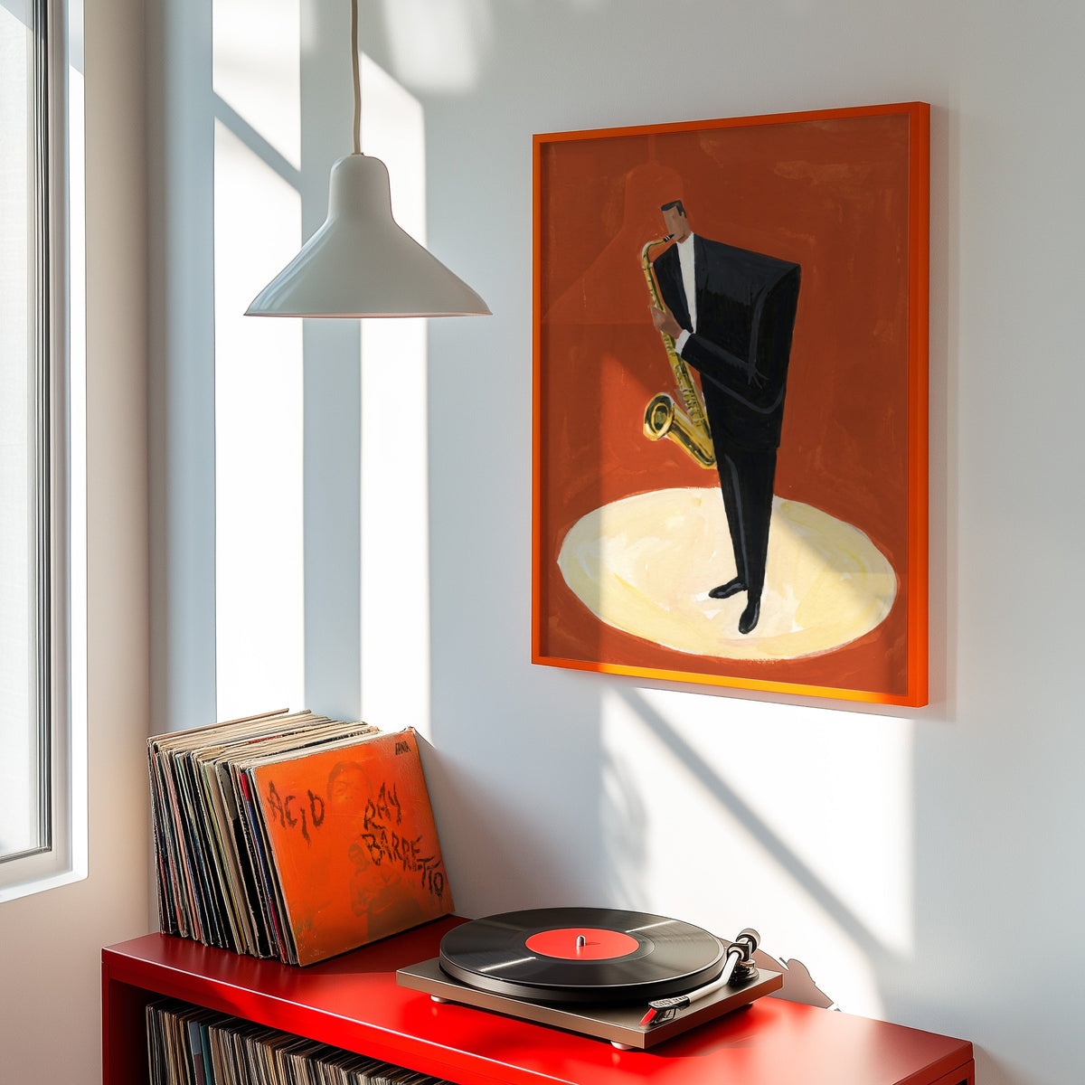 Saxophonist in spotlight print shown in an orange frame above a red record cabinet and turntable
