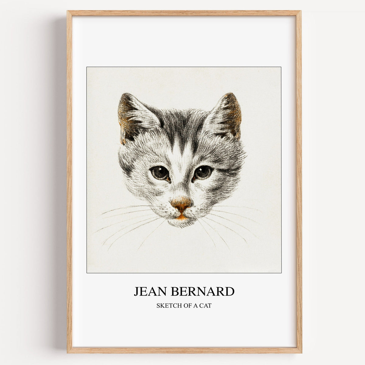Jean Bernard Sketch of a Cat print in a light oak frame on a plain white wall