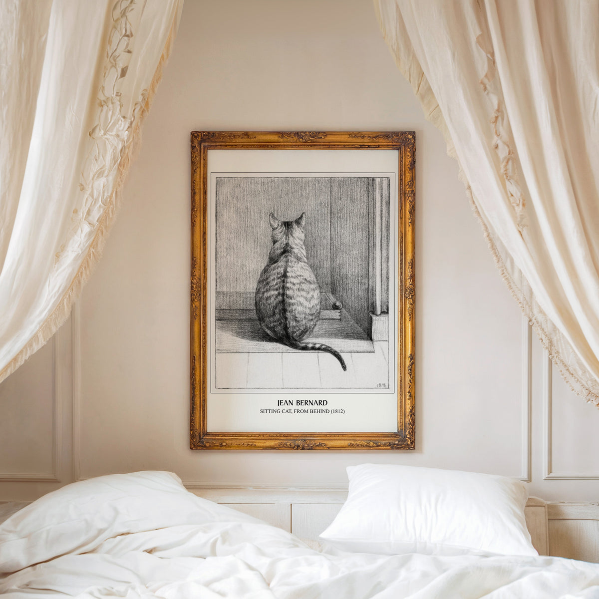 Sitting Cat print shown in an ornate gold frame above a canopy bed