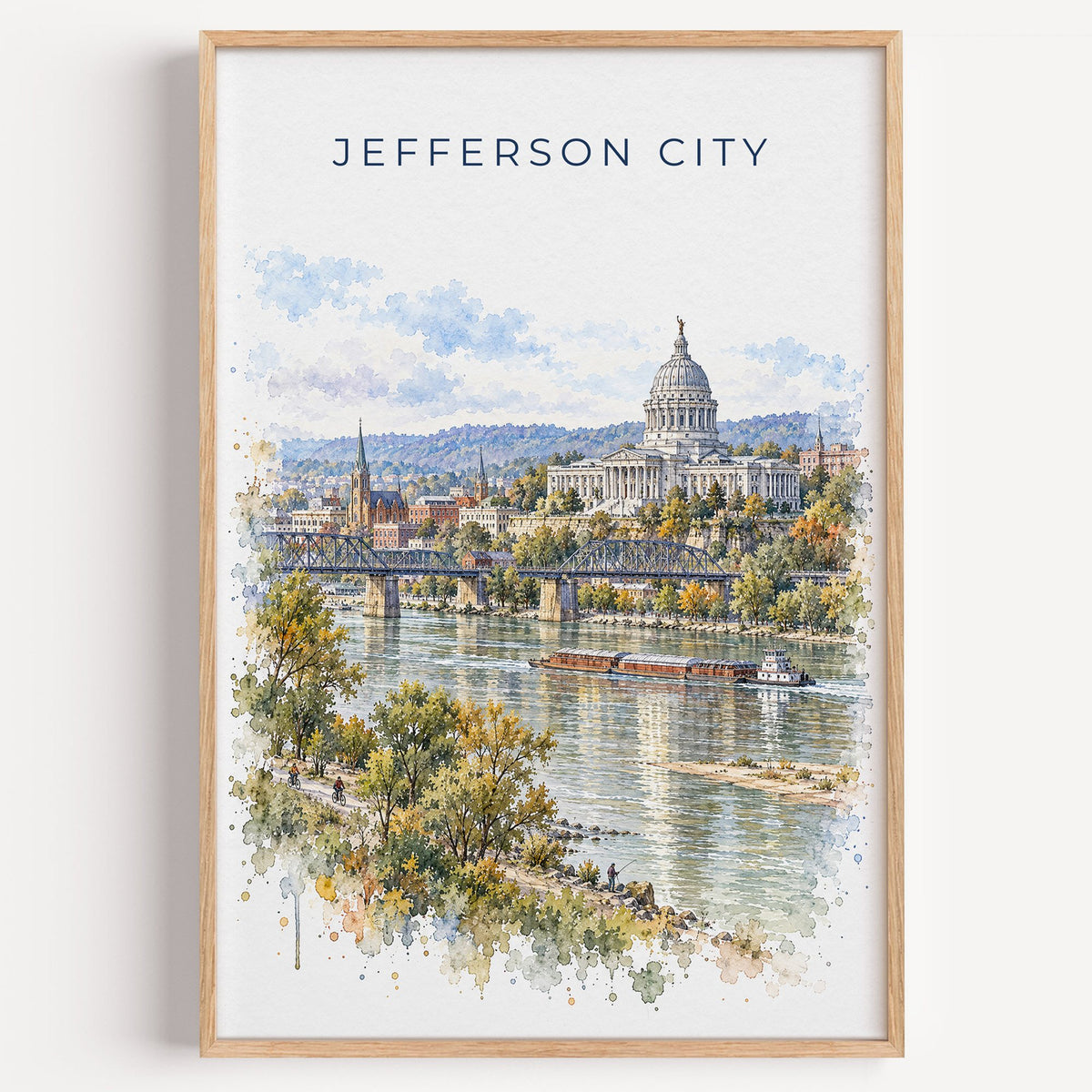 Jefferson City watercolor print in a light oak frame on a plain white wall